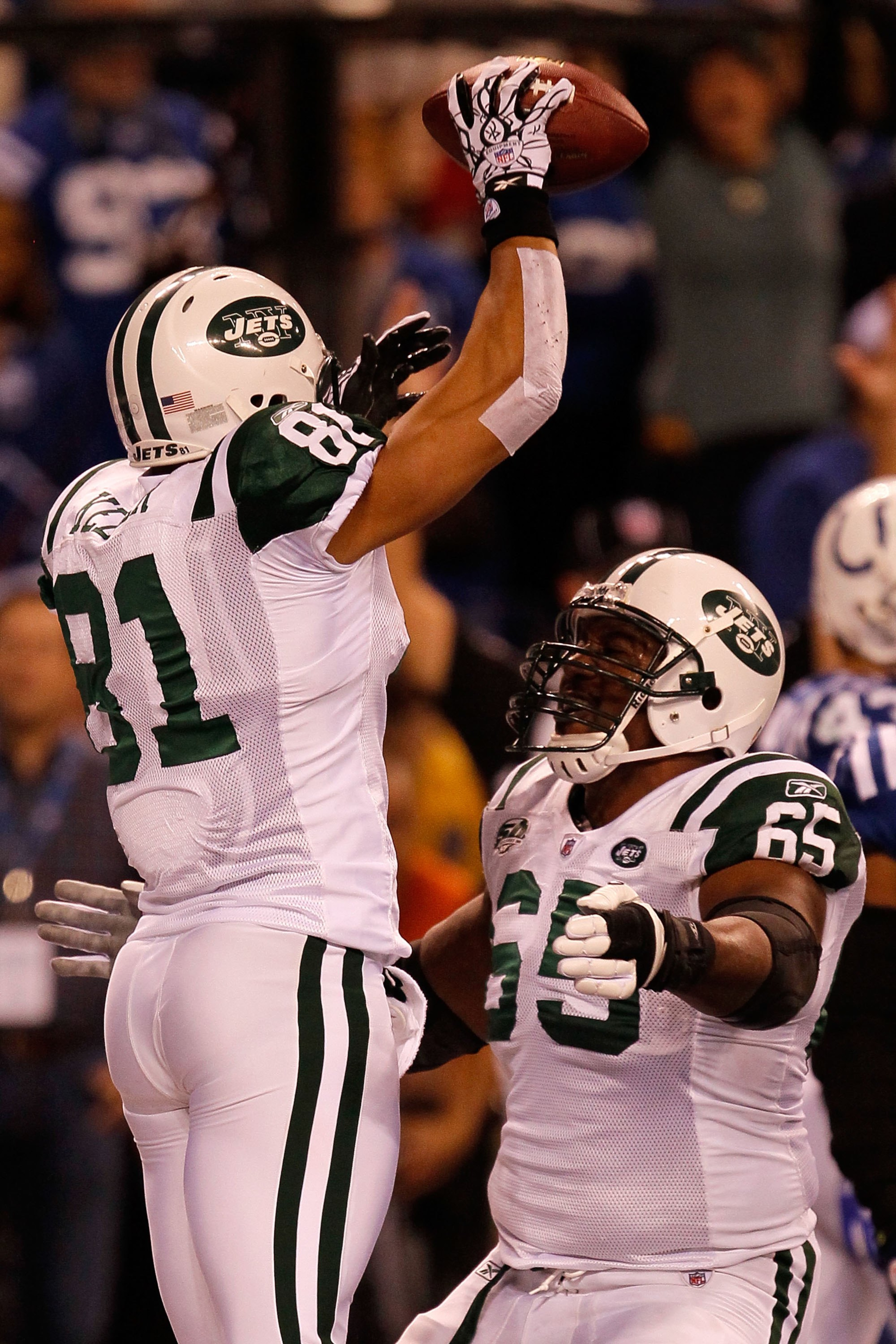 INDIANAPOLIS - JANUARY 24:  Dustin Keller #81 of the New York Jets celebrates his touchdown in the second quarter with teammate Brandon Moore #65 while playing against the Indianapolis Colts during the AFC Championship Game at Lucas Oil Stadium on January