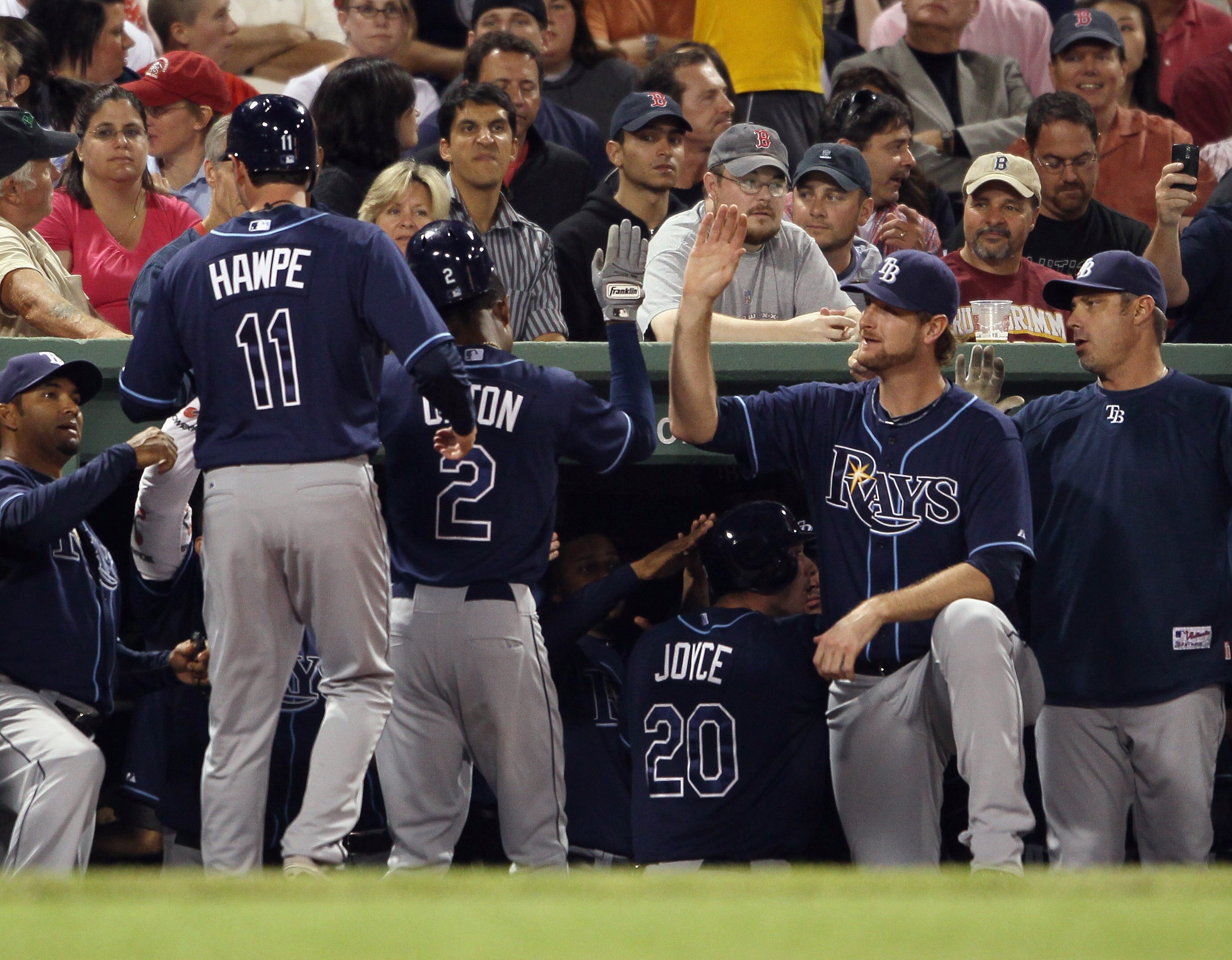 BOSTON - SEPTEMBER 08:  B.J. Upton #2 of the Tampa Bay Rays is congratulated by teamamtes after he hit a three run homer in the second inning against the Boston Red Sox defends on September 8, 2010 at Fenway Park in Boston, Massachusetts.  (Photo by Elsa/