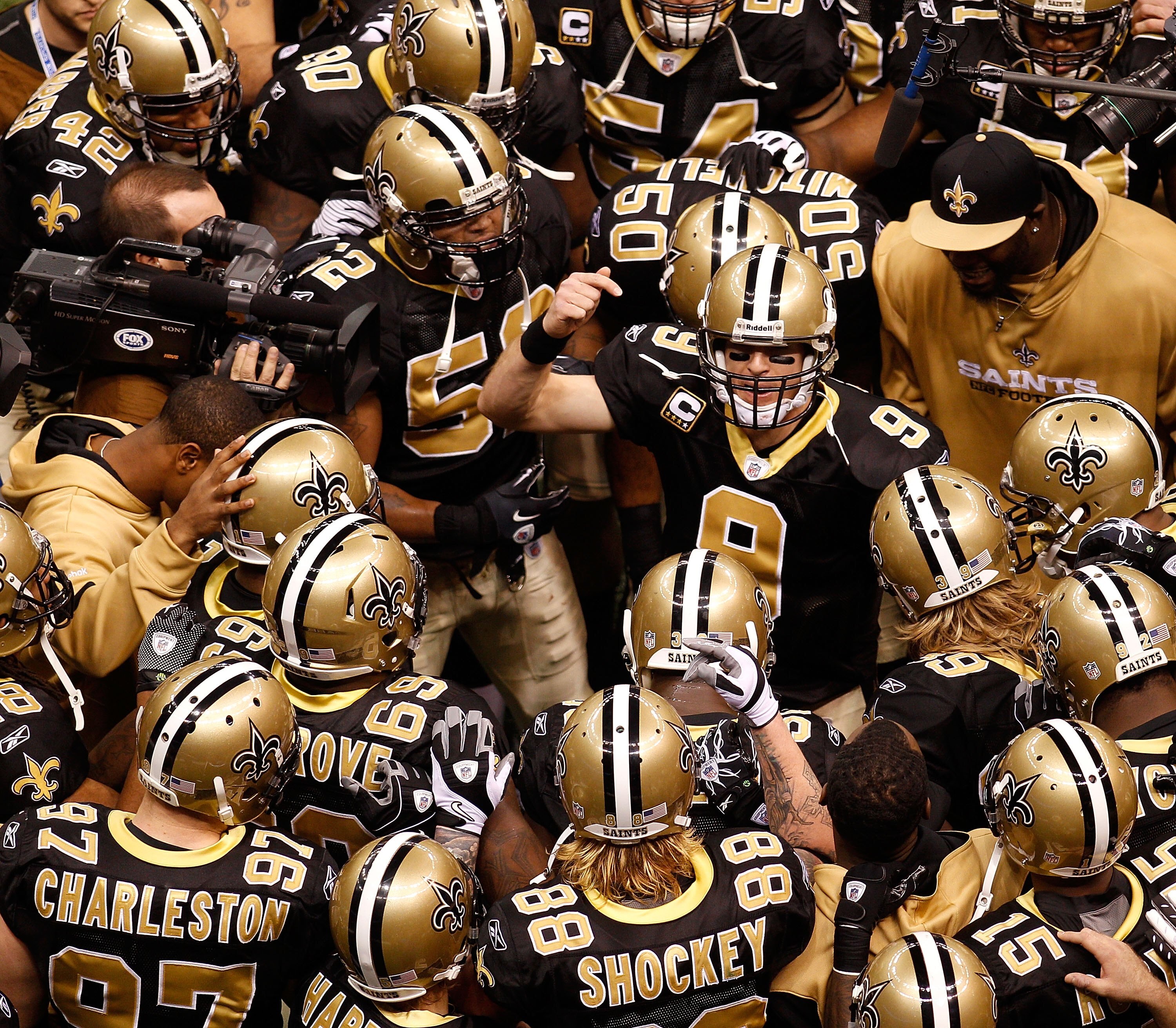 NEW ORLEANS - JANUARY 24:  Quarterback Drew Brees #9 of the New Orleans Saints addresses his teammates prior to playing against the Minnesota Vikings during the NFC Championship Game at the Louisiana Superdome on January 24, 2010 in New Orleans, Louisiana