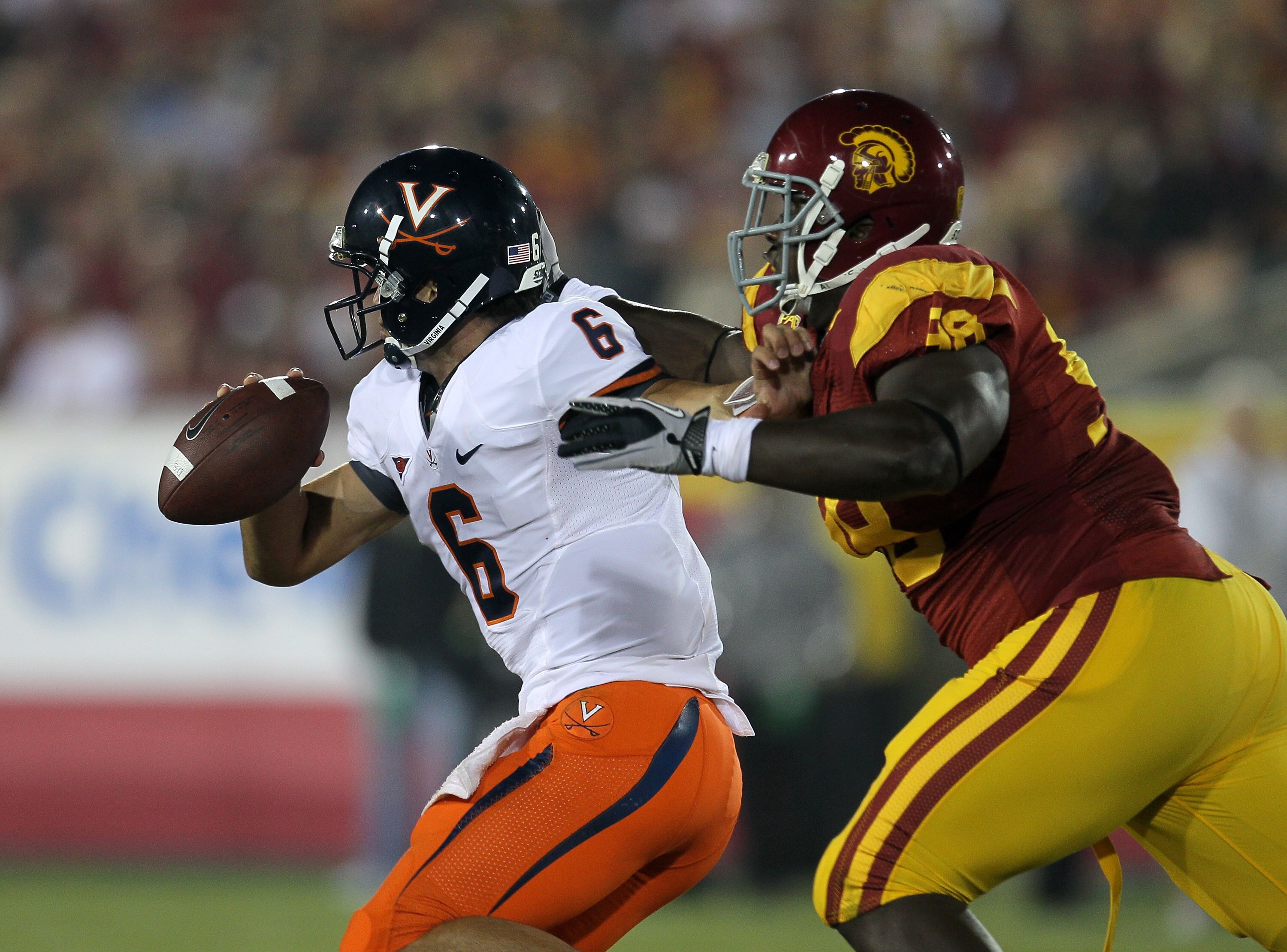 LOS ANGELES - SEPTEMBER 11:  Defensive lineman DaJohn Harris #98 of the USC Trojans sacks quarterback Marc Verica #6 of the Virginia Cavaliers at Los Angeles Memorial Coliseum on September 11, 2010 in Los Angeles, California. USC won 17-14.  (Photo by Ste