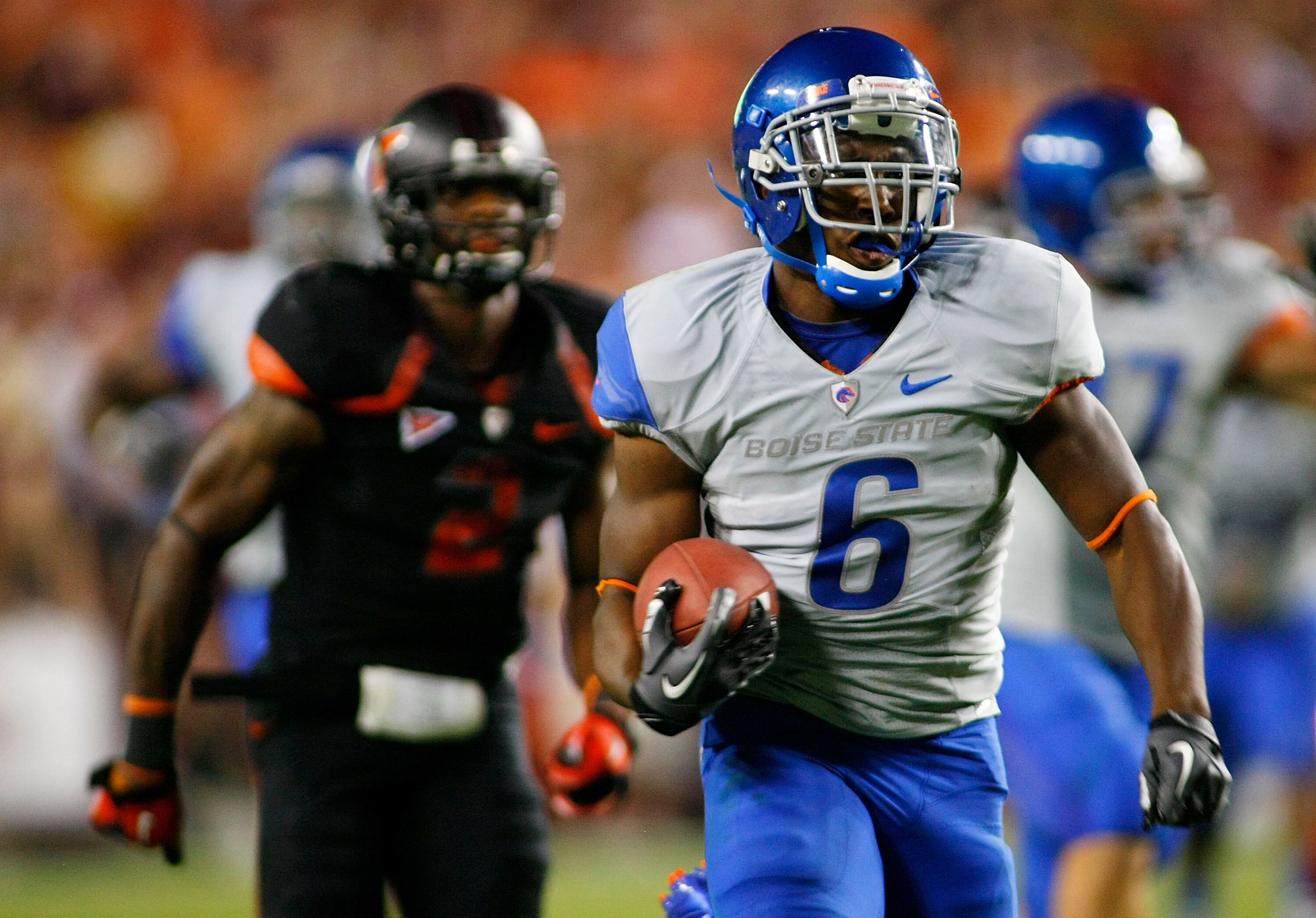 LANDOVER, MD - SEPTEMBER 06:  Running back #6 D.J. Harper of the Boise State Broncos runs for a touchdown as  safety #2 Davon Morgan of the Virginia Tech Hokies chases at FedExField on September 6, 2010 in Landover, Maryland.  (Photo by Geoff Burke/Getty