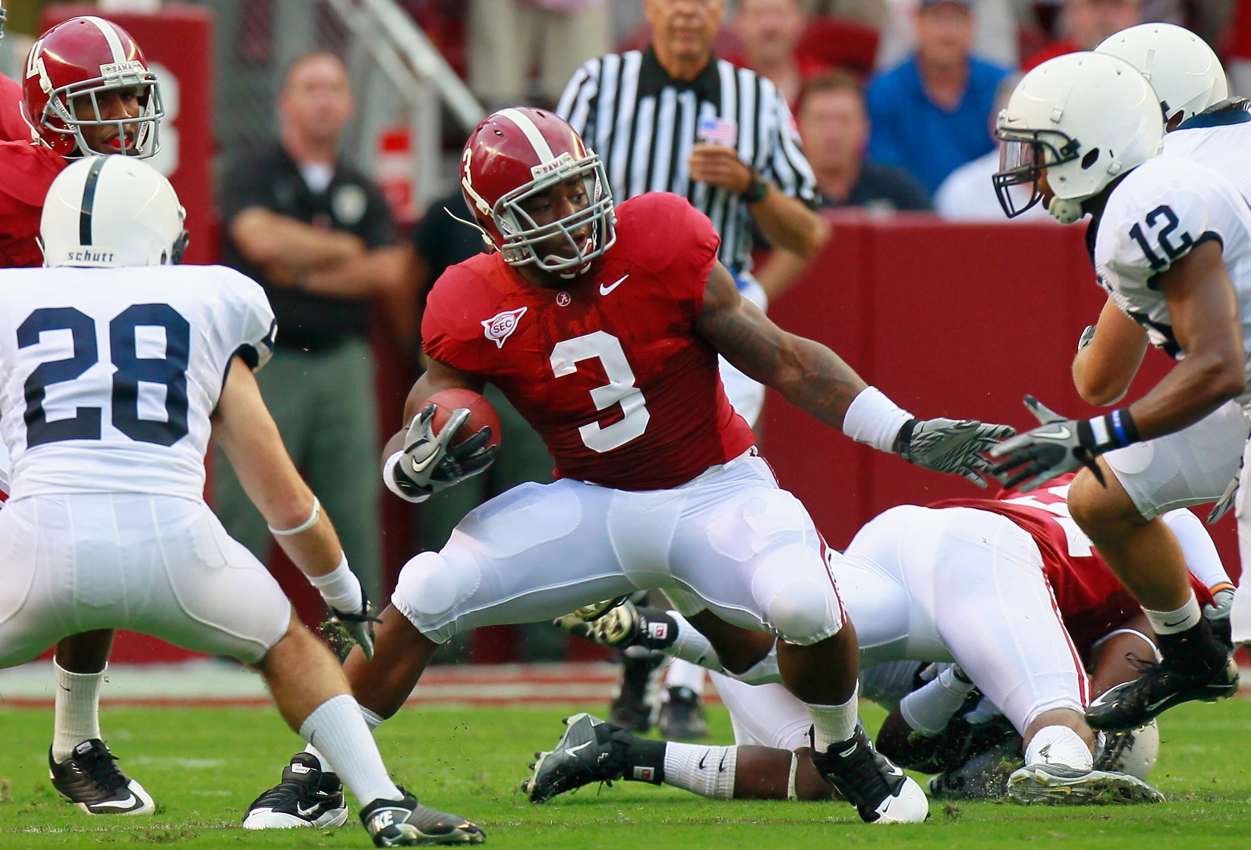 TUSCALOOSA, AL - SEPTEMBER 11:  Trent Richardson #3 of the Alabama Crimson Tide rushes against Drew Astorino #28 and Stephon Morris #12 of the Penn State Nittany Lions at Bryant-Denny Stadium on September 11, 2010 in Tuscaloosa, Alabama.  (Photo by Kevin 