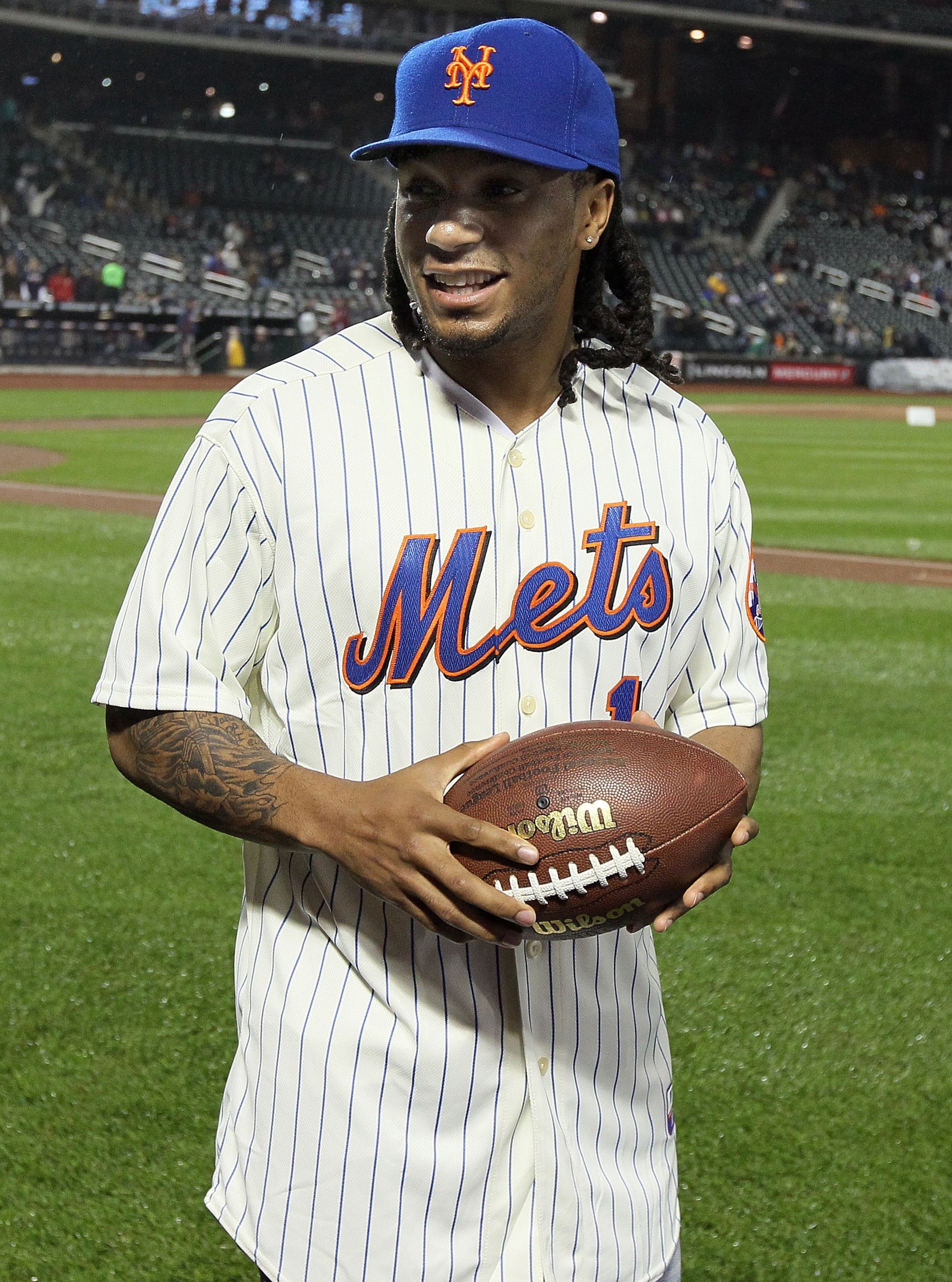 NEW YORK - APRIL 25:  2010 New York Jets first round draft pick Kyle Wilson looks on before the the New York Mets play the Atlanta Braves on April 25, 2010 at Citi Field in the Flushing neighborhood of the Queens borough of New York City.  (Photo by Jim M