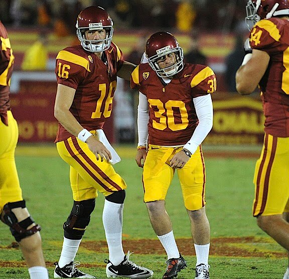 Place kicker Joe Houston and holder Mitch Mustain react after missed 47-yard field goal