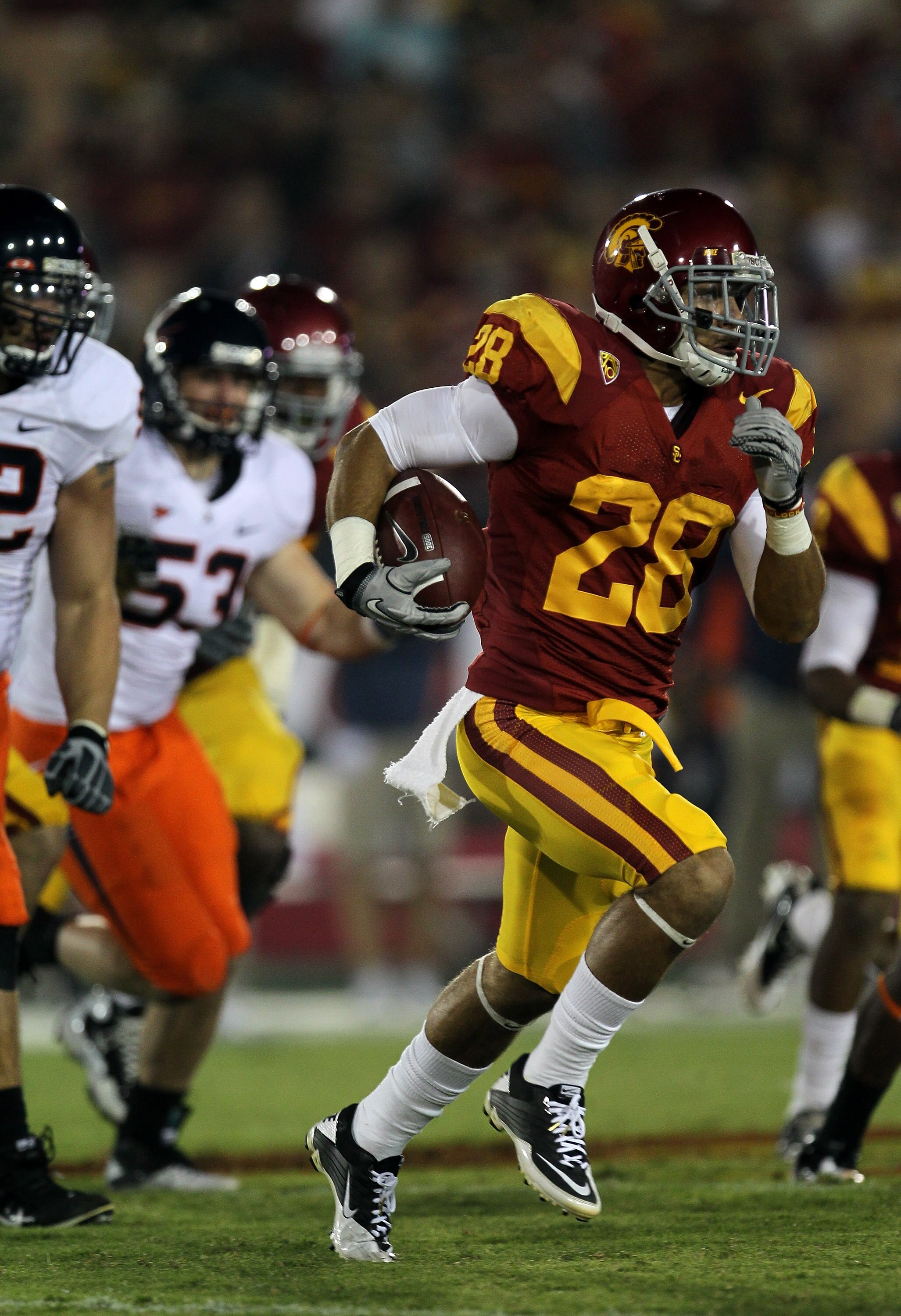 LOS ANGELES, CA - SEPTEMBER 11:  Running back Dillon Baxter #28 of the USC Trojans carries the ball against the Virginia Cavaliers at Los Angeles Memorial Coliseum on September 11, 2010 in Los Angeles, California. USC won 17-14.  (Photo by Stephen Dunn/Ge