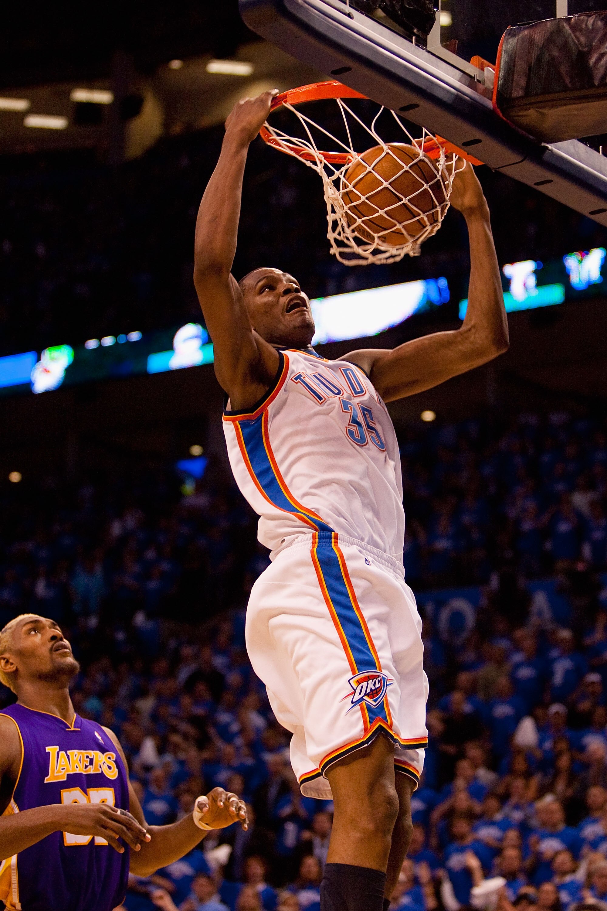 OKLAHOMA CITY - APRIL 22:  Kevin Durant #35 of the Oklahoma City Thunder dunks the ball against Ron Artest #37 of the Los Angeles Lakers during Game Three of the Western Conference Quarterfinals of the 2010 NBA Playoffs on April 22, 2010 at the Ford Cente