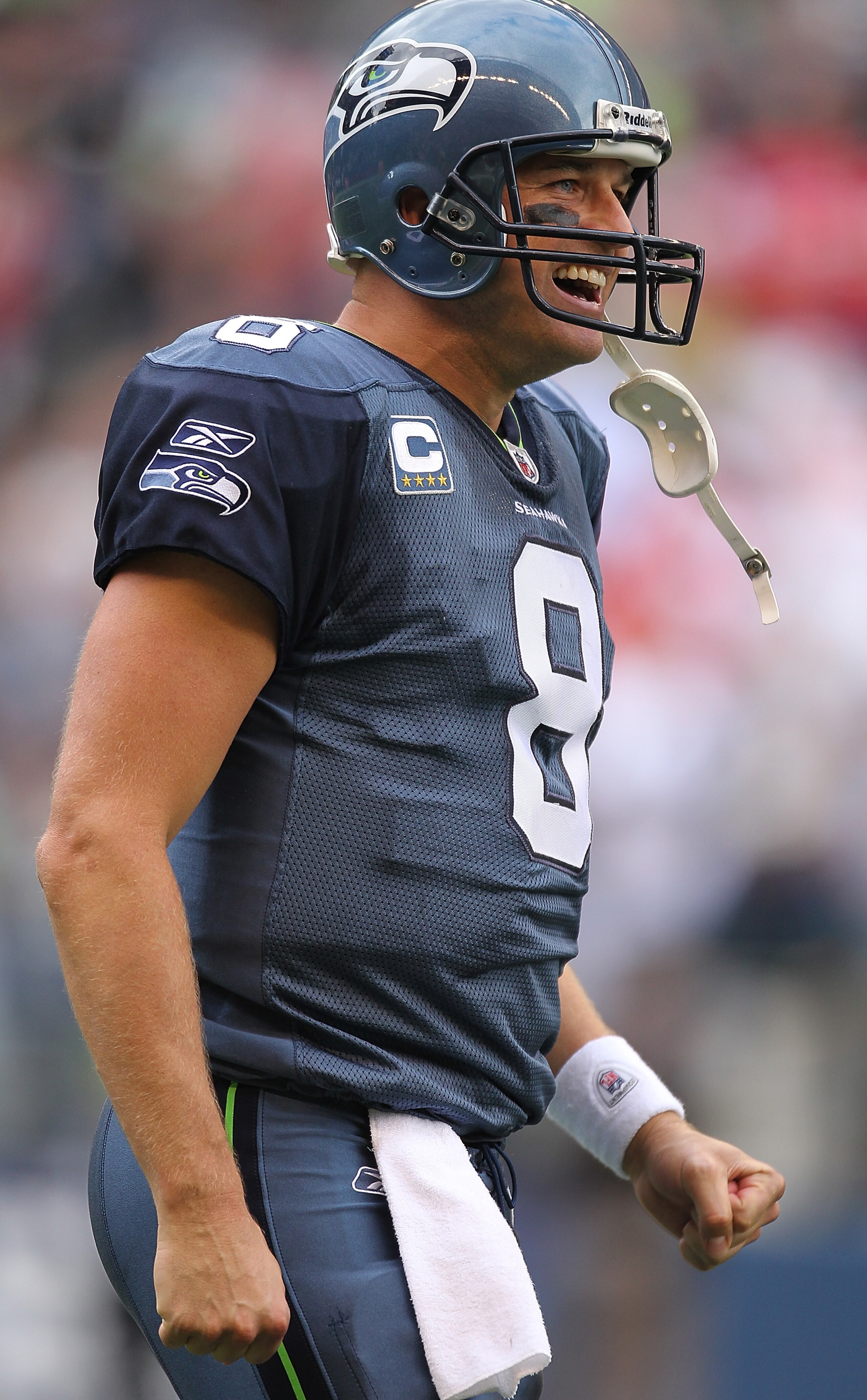 SEATTLE - SEPTEMBER 12:  Quarterback Matt Hasselbeck #8 of the Seattle Seahawks celebrates a leaping catch by John Carlson #89 during the NFL season opener against the San Francisco 49ers at Qwest Field on September 12, 2010 in Seattle, Washington. The Se