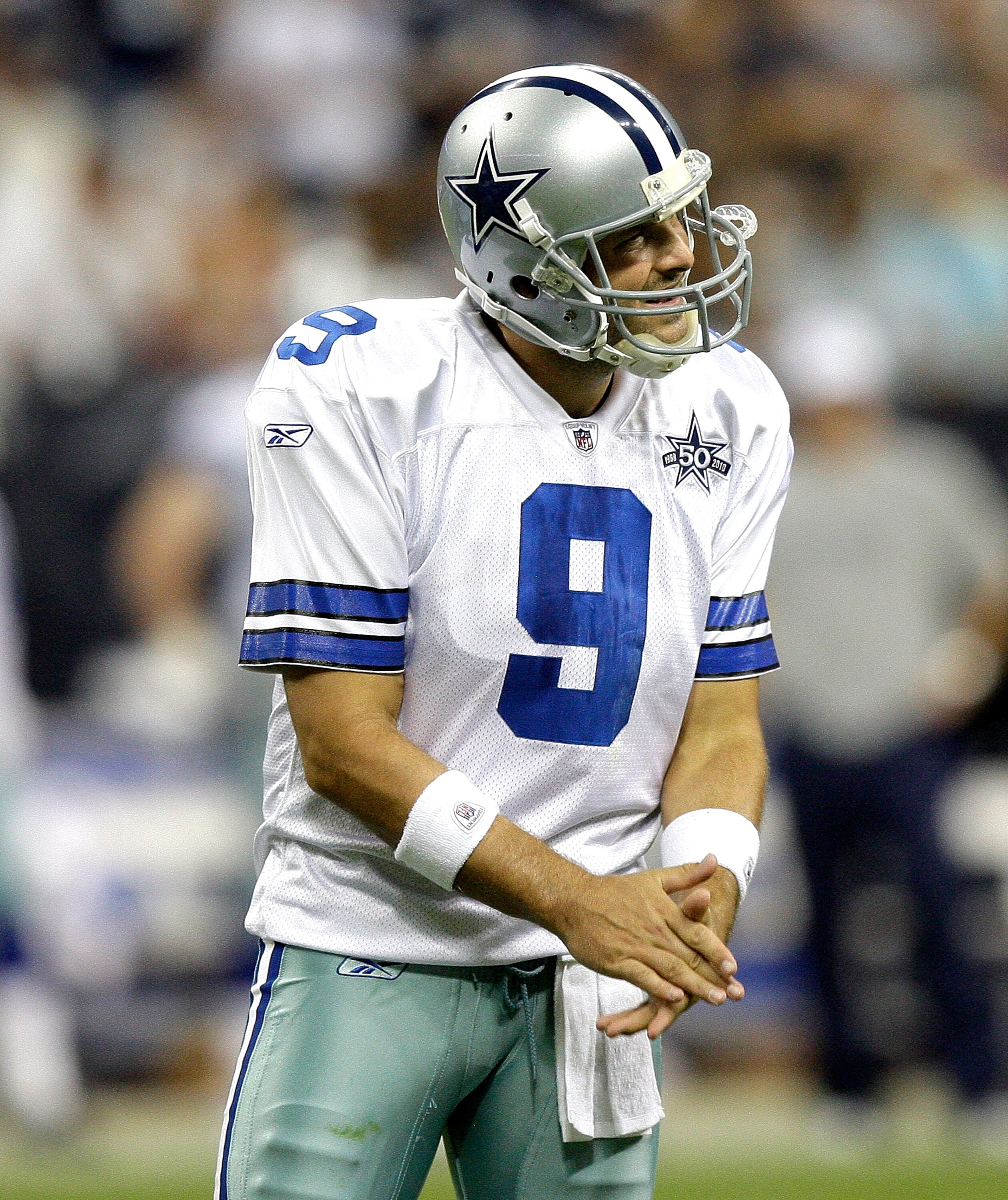 HOUSTON - AUGUST 28: Quarterback Tony Romo #9 of the Dallas Cowboys encourages his offensive line after a penalty was called on the play during a football game against the Houston Texans at Reliant Stadium on August 28, 2010 in Houston, Texas. Houston won
