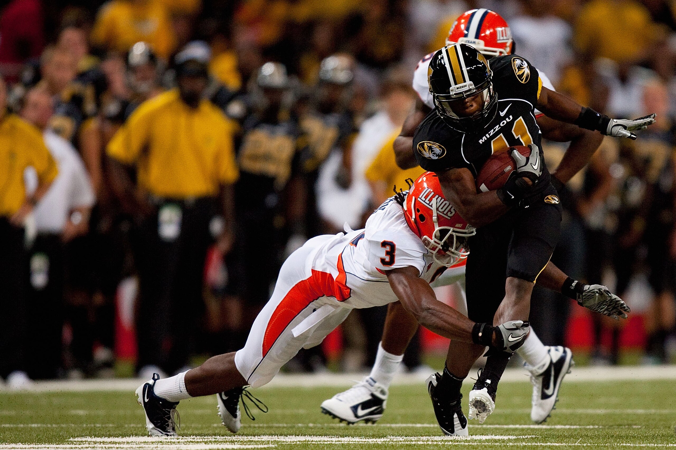 ST. LOUIS - SEPTEMBER 4: Tavon Wilson #3 of the University of Illinois Fighting Illini attempts to tackle Henry Josey #41 of the University of Missouri Tigers during the State Farm Arch Rivalry game on September 4, 2010 at the Edward Jones Dome in St. Lou