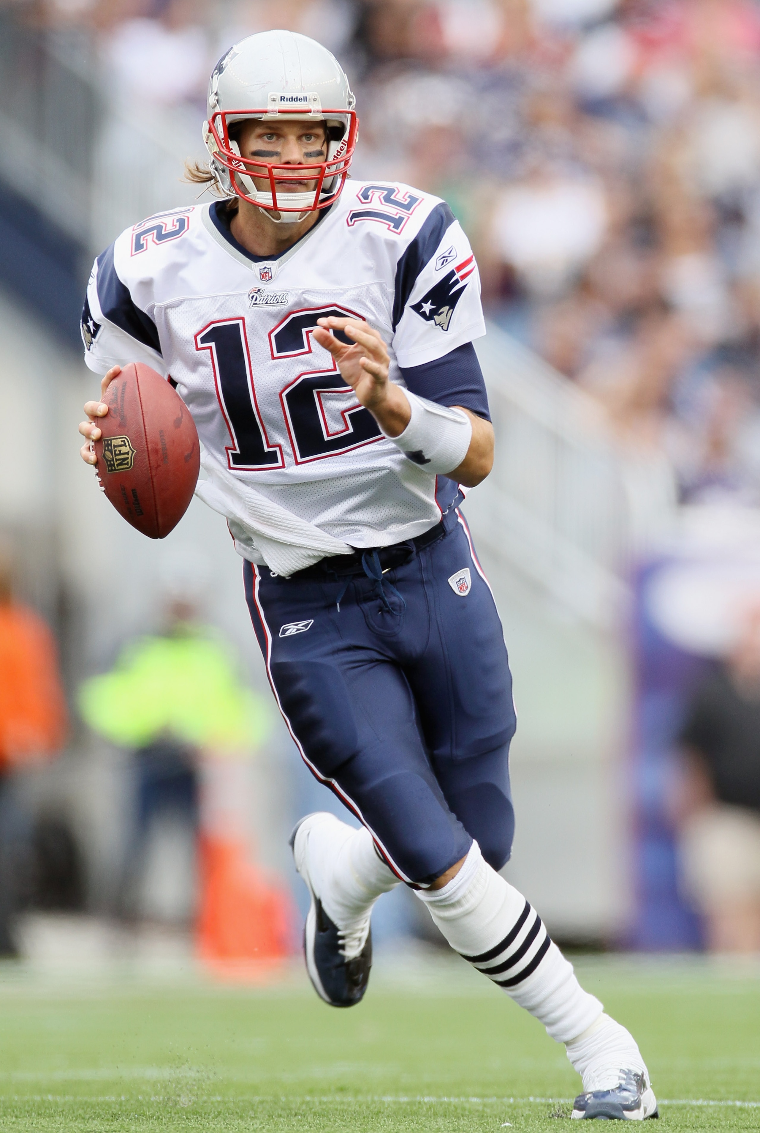 FOXBORO, MA - SEPTEMBER 12:  Tom Brady #12 of the New England Patriots scrambles against the Cincinnati Bengals during the NFL season opener on September 12, 2010 at Gillette Stadium in Foxboro, Massachusetts.  (Photo by Elsa/Getty Images)