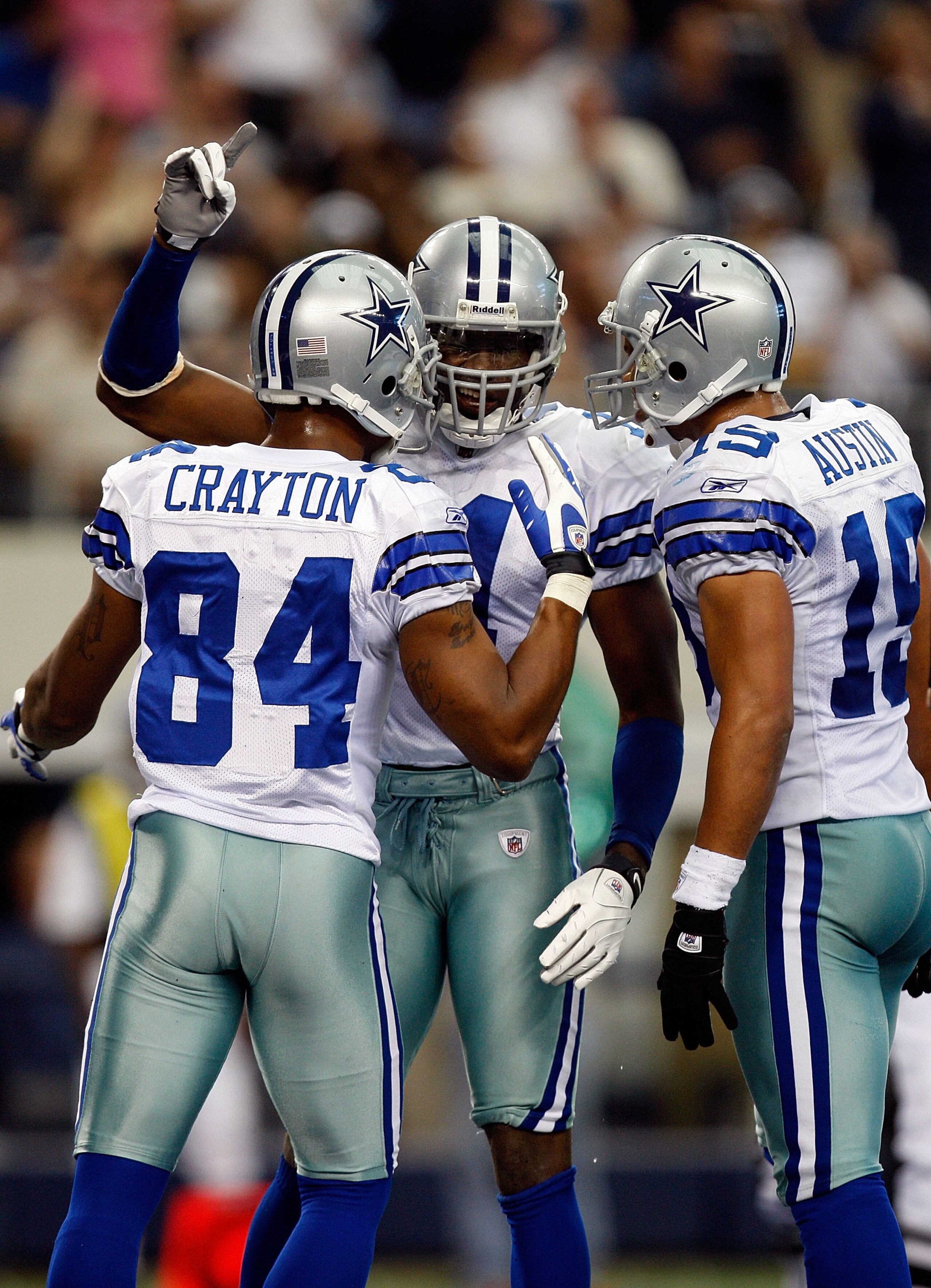 ARLINGTON, TX - NOVEMBER 01:  Wide receiver Roy Williams #11 celebrates a touchdown with Patrick Crayton #84 and Miles Austin #18 of the Dallas Cowboys at Cowboys Stadium on November 1, 2009 in Arlington, Texas.  (Photo by Ronald Martinez/Getty Images)