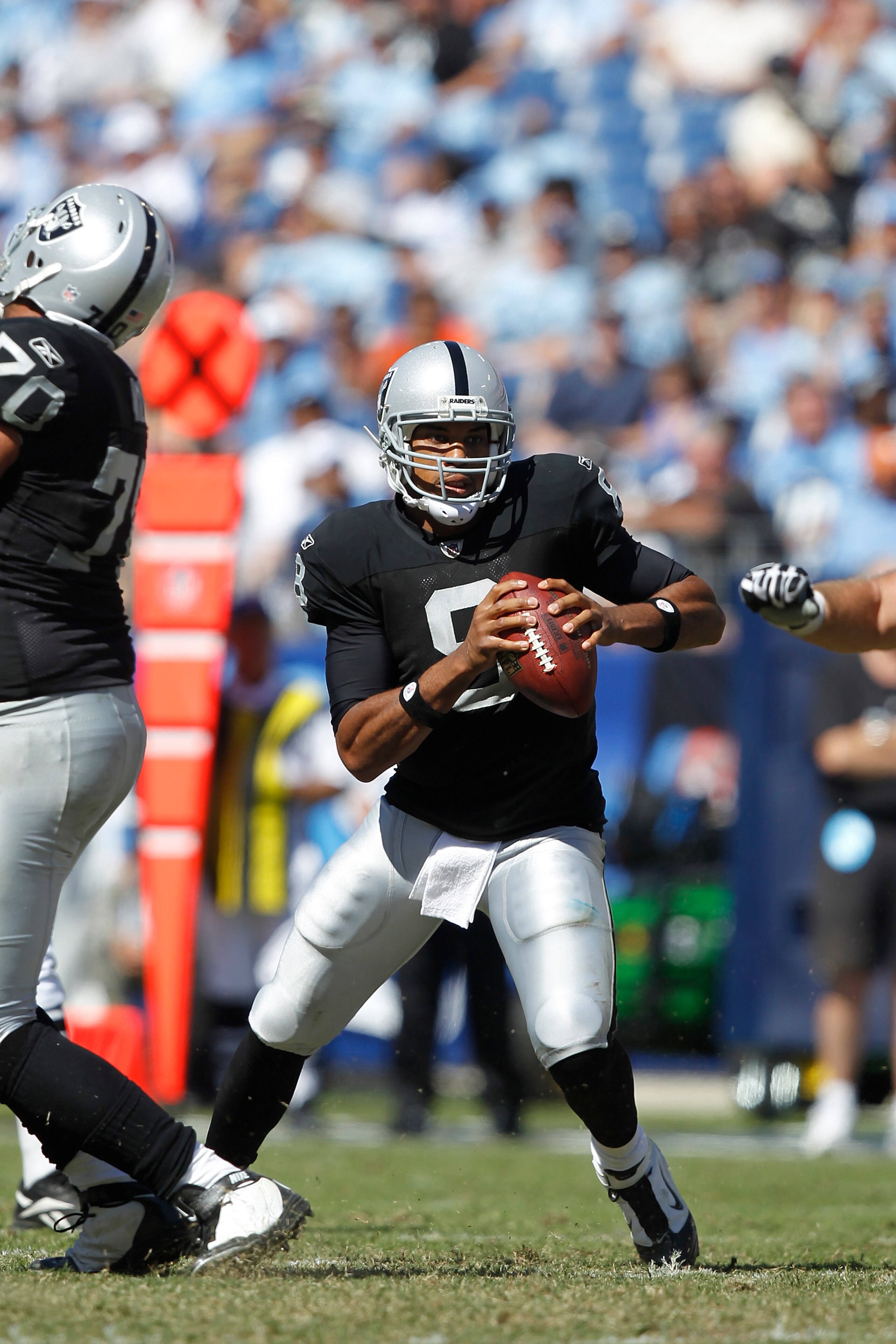 NASHVILLE - SEPTEMBER 12: Jason Campbell #8 of the Oakland Raiders looks to pass against the Tennessee Titans during the NFL season opener at LP Field on September 12, 2010 in Nashville, Tennessee. The Titans defeated the Raiders 38-13. (Photo by Joe Robb NASHVILLE - SEPTEMBER 12: Jason Campbell #8 of the Oakland Raiders looks to pass against the Tennessee Titans during the NFL season opener at LP Field on September 12, 2010 in Nashville, Tennessee. The Titans defeated the Raiders 38-13. (Photo by Joe Robb