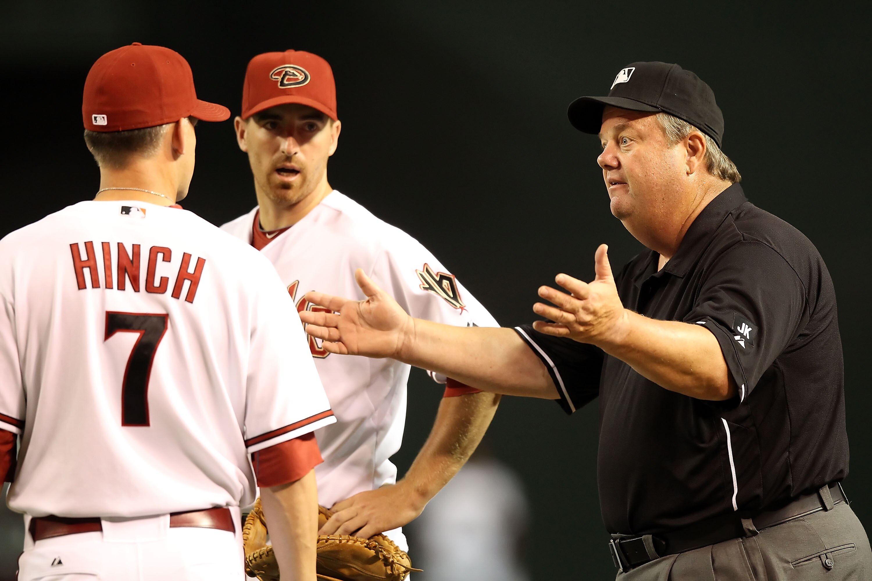 PHOENIX - JUNE 08:  First base umpire Joe West reacts to manager A.J. Hinch of the Arizona Diamondbacks during the Major League Baseball game against the Atlanta Braves at Chase Field on June 8, 2010 in Phoenix, Arizona.  (Photo by Christian Petersen/Gett
