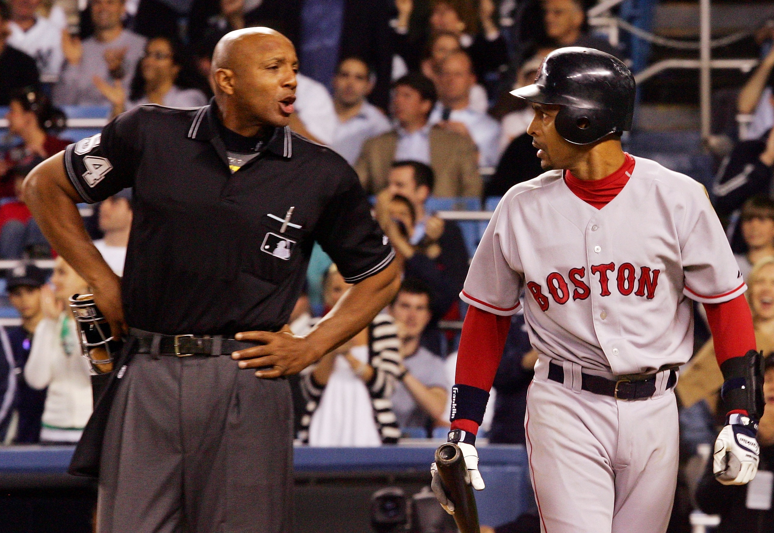 NEW YORK - MAY 23: Julio Lugo #23 of the Boston Red Sox argues a call with home plate umpire C.B. Bucknor in the ninth inning against the New York Yankees at Yankee Stadium on May 23, 2007 in the Bronx borough of New York City.  (Photo by Jim McIsaac/Gett
