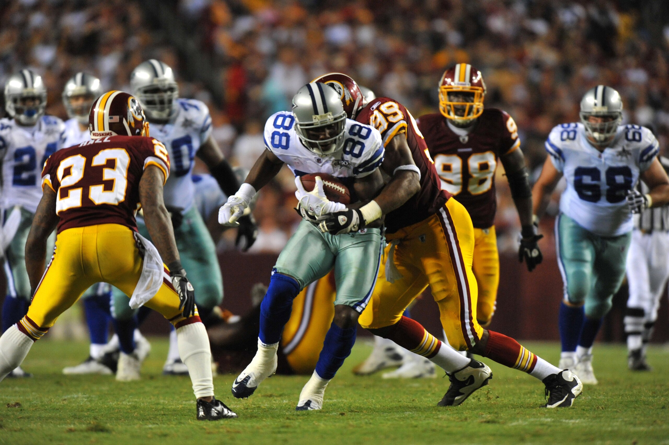 LANDOVER - SEPTEMBER 12:  Dez Bryant #88 of the Dallas Cowboys runs the ball during the NFL season opener against the Washington Redskins at FedExField on September 12, 2010 in Landover, Maryland. The Redskins defeated the Cowboys 13-7. (Photo by Larry Fr