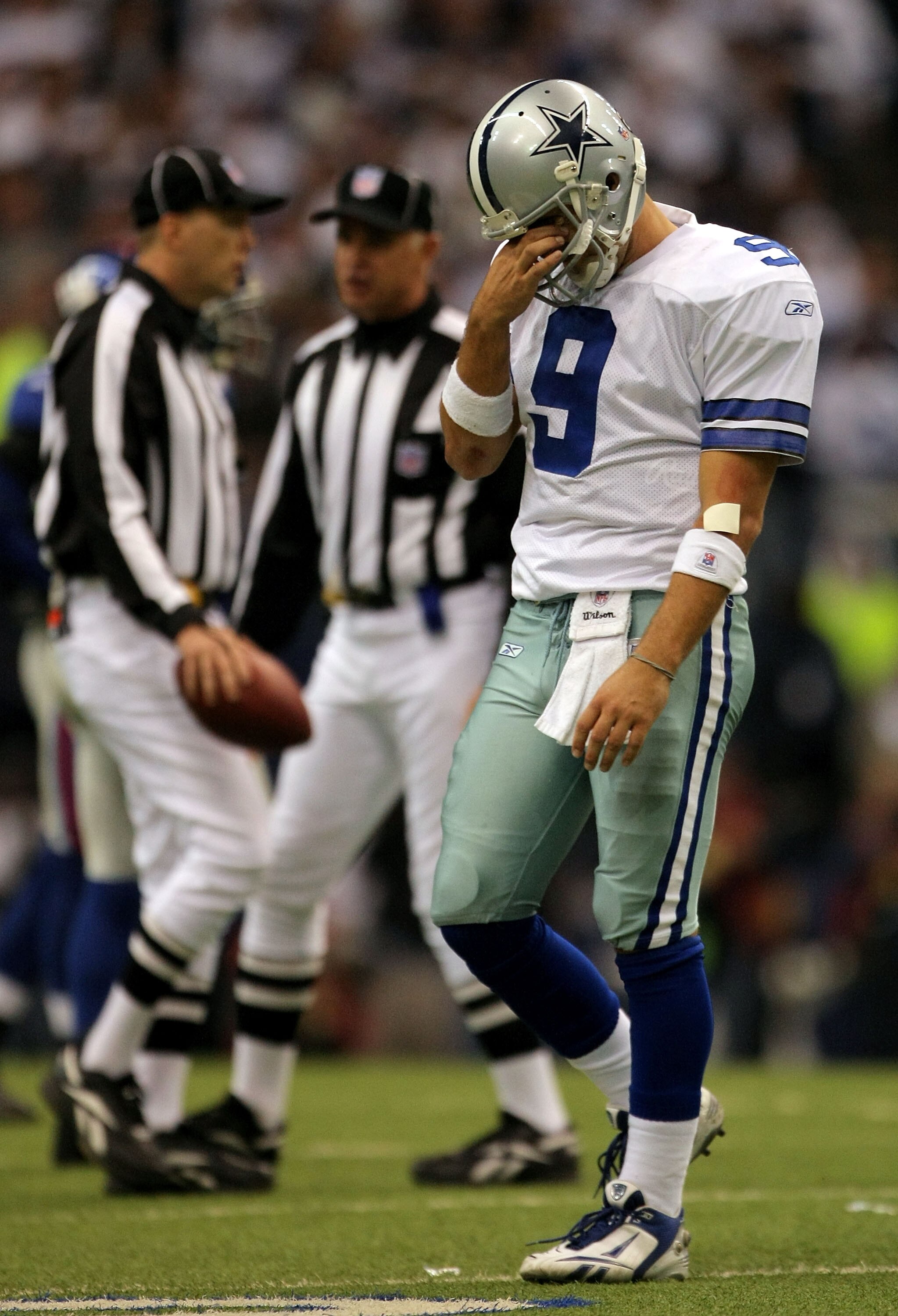 IRVING, TX - JANUARY 13:  Quarterback Tony Romo #9 of the Dallas Cowboys reacts after an intentional grounding penalty during the fourth quarter of the NFC Divisional Playoff game against the New York Giants at Texas Stadium on January 13, 2008 in Irving,