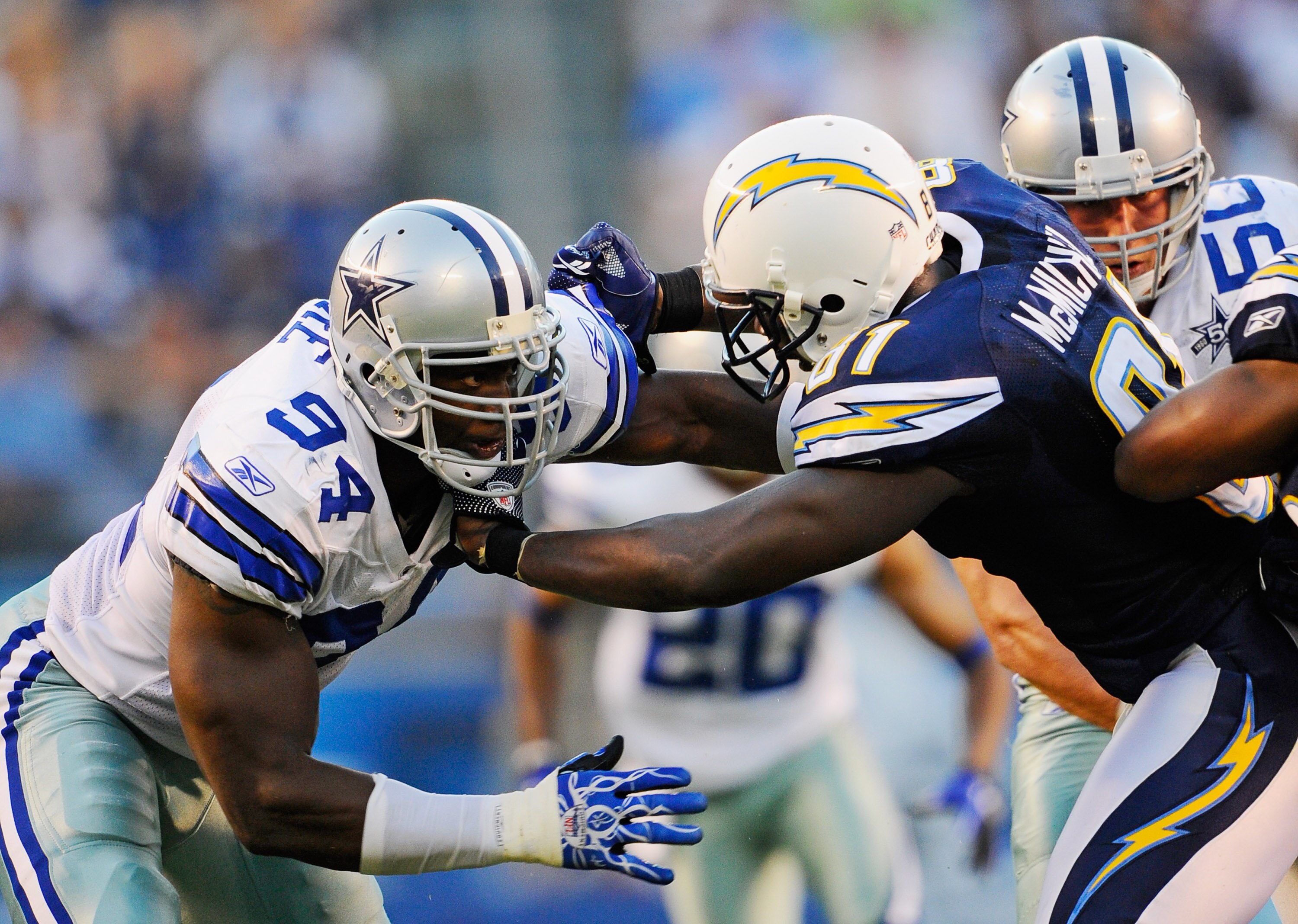 SAN DIEGO - AUGUST 21:  Line backer DeMarcus Ware #94 of the Dallas Cowboys in action against tight end Randy McMichael #81 of the San Diego Chargers at Qualcomm Stadium on August 21, 2010 in San Diego, California.  (Photo by Kevork Djansezian/Getty Image