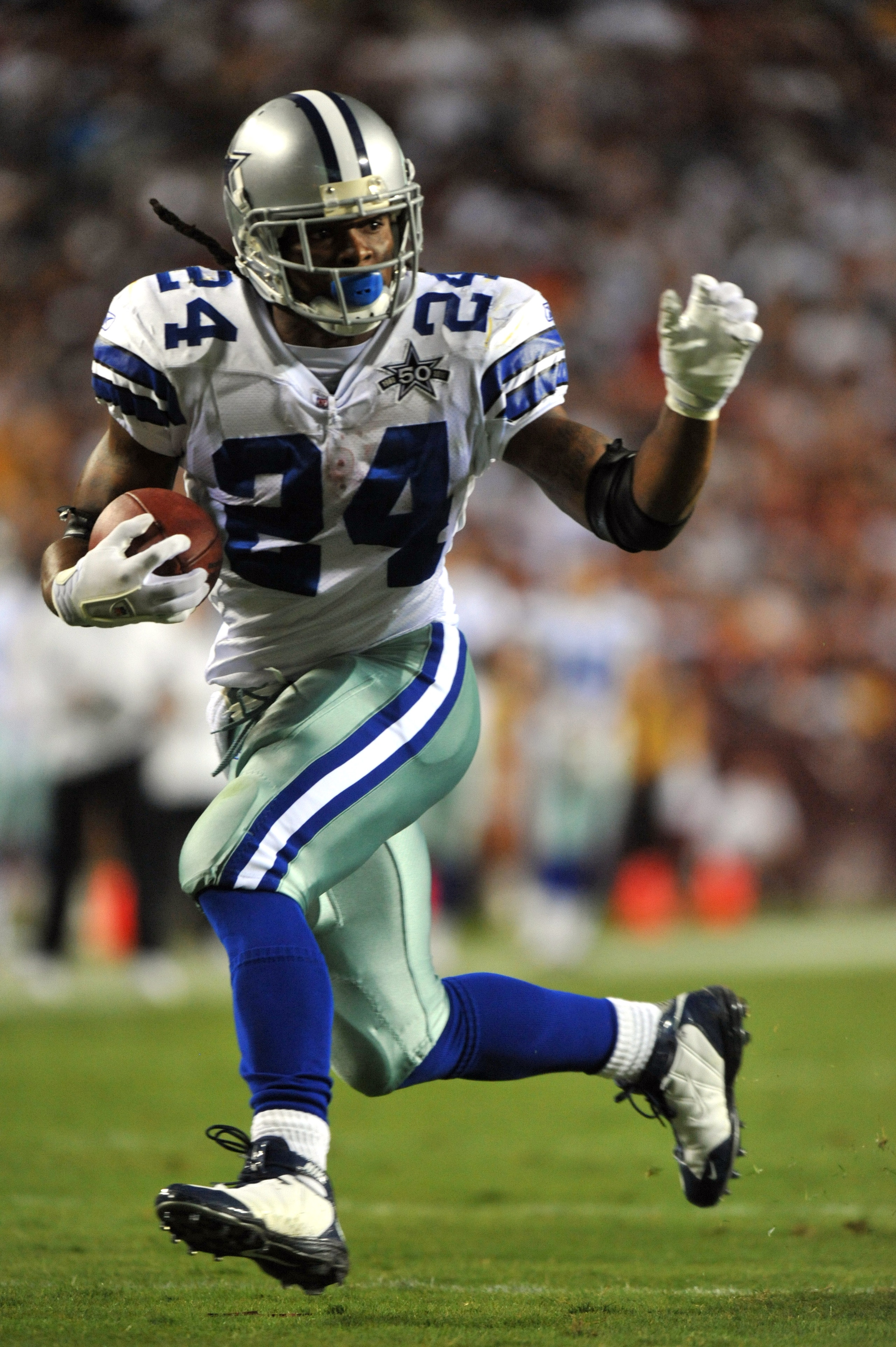 LANDOVER - SEPTEMBER 12:  Marion Barber #24 of the Dallas Cowboys runs the ball during the NFL season opener against the Washington Redskins at FedExField on September 12, 2010 in Landover, Maryland. The Redskins defeated the Cowboys 13-7. (Photo by Larry