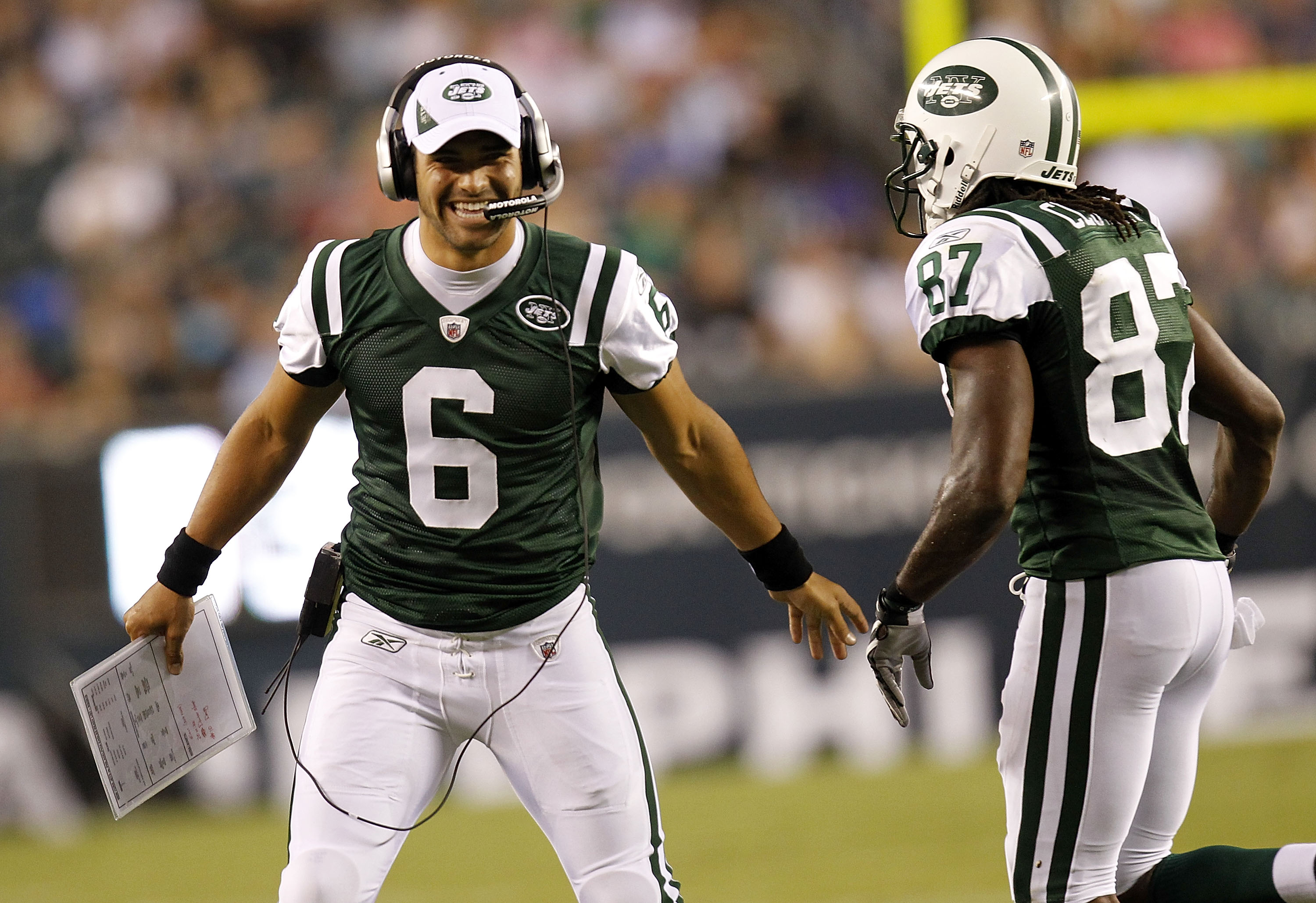 PHILADELPHIA - SEPTEMBER 02: Mark Sanchez #6 greets David Clowney #87 of the New York Jets on the sidelines during a preseason game against the Philadelphia Eagles at Lincoln Financial Field on September 2, 2010 in Philadelphia, Pennsylvania. (Photo by Je
