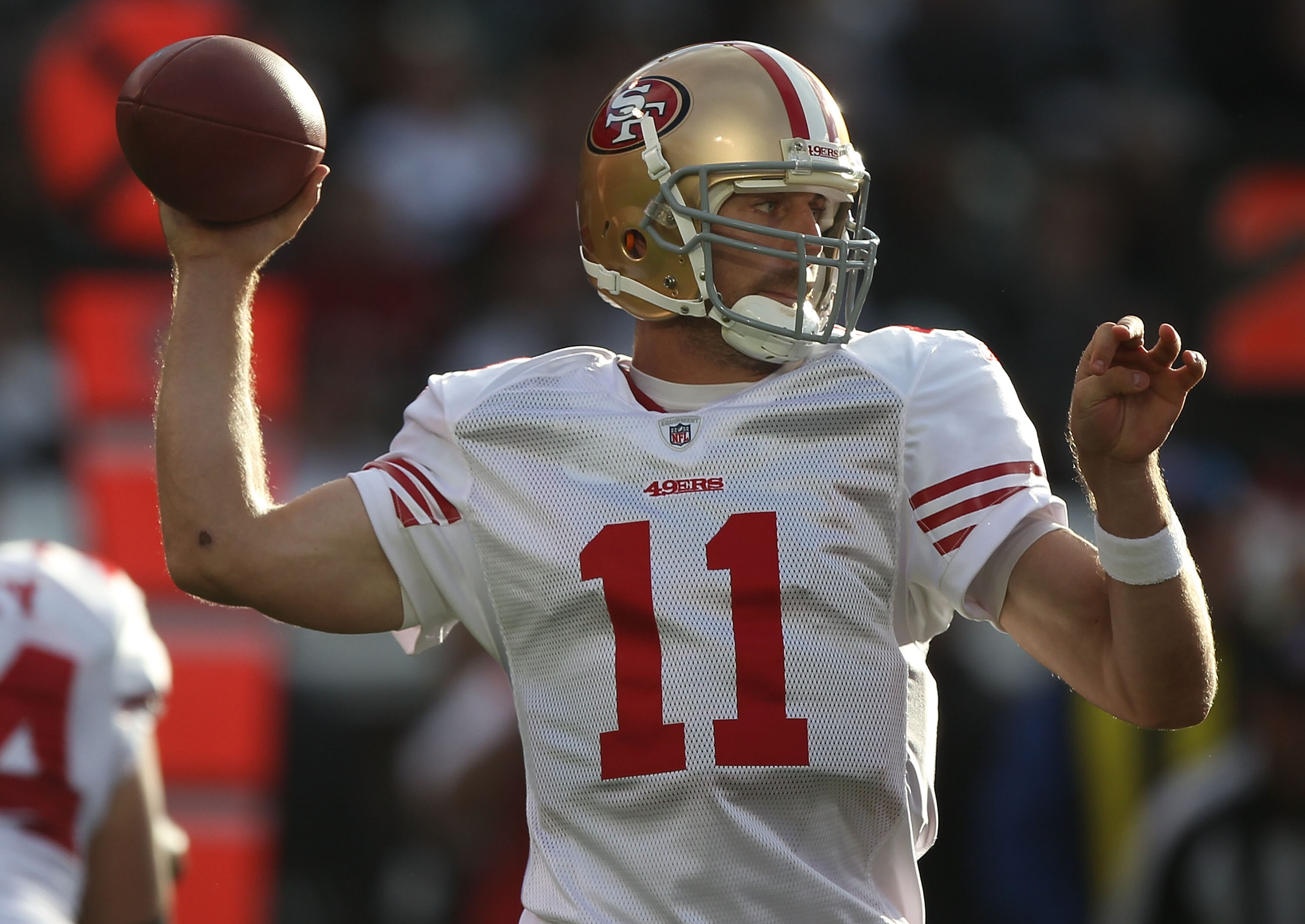 OAKLAND, CA - AUGUST 28:  Alex Smith #11 of the San Francisco 49ers passes against the Oakland Raiders during an NFL preseason game at Oakland-Alameda County Coliseum on August 28, 2010 in Oakland, California.  (Photo by Jed Jacobsohn/Getty Images)