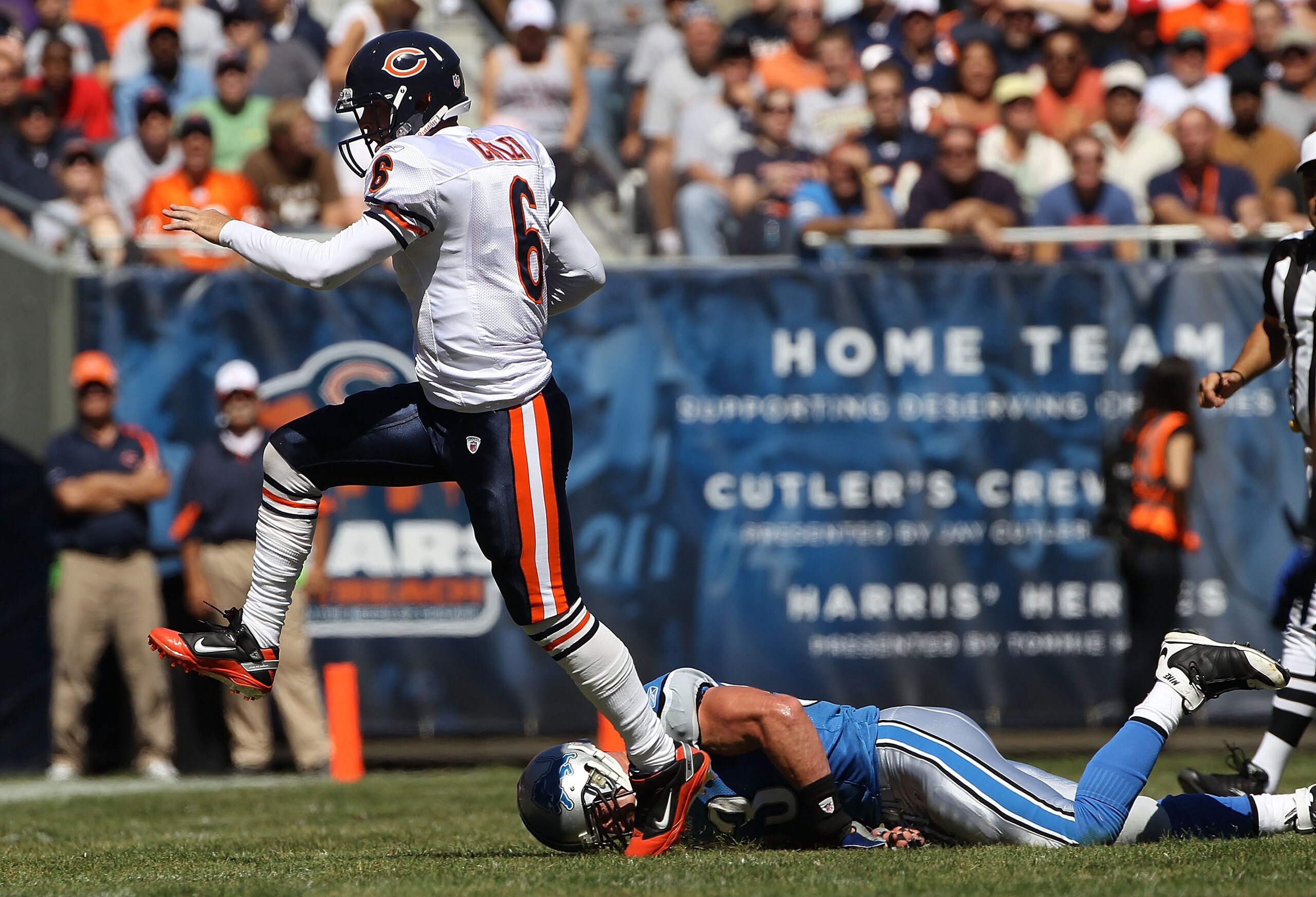 CHICAGO - SEPTEMBER 12: Jay Cutler #6 of the Chicago Bears escapes from Kyle Vanden Bosch #93 of the Detroit Lions during the NFL season opening game at Soldier Field on September 12, 2010 in Chicago, Illinois. The Bears defeated the Lions 19-14. (Photo b