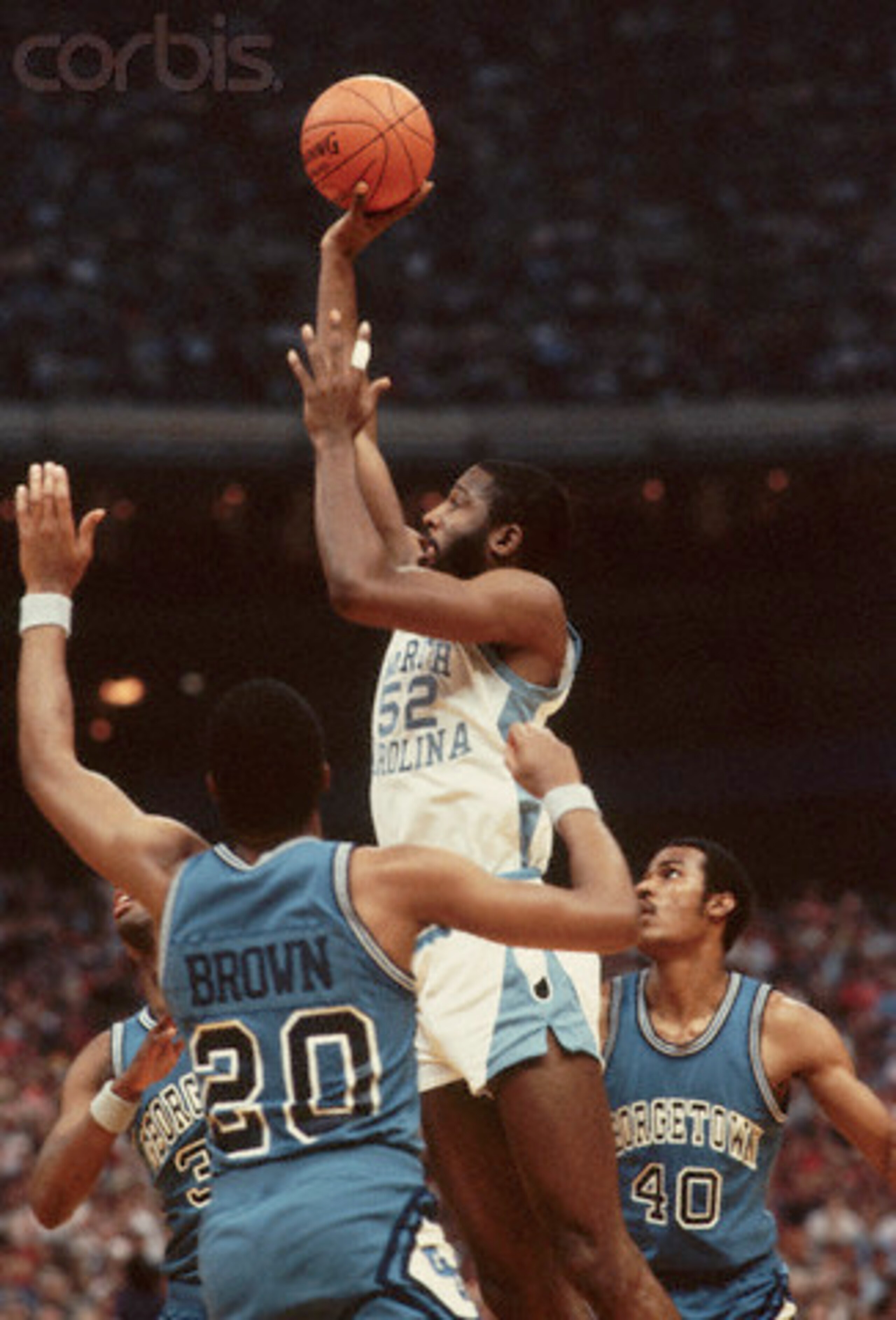 James Worthy reminds Georgetown's Fred Brown who he plays for.