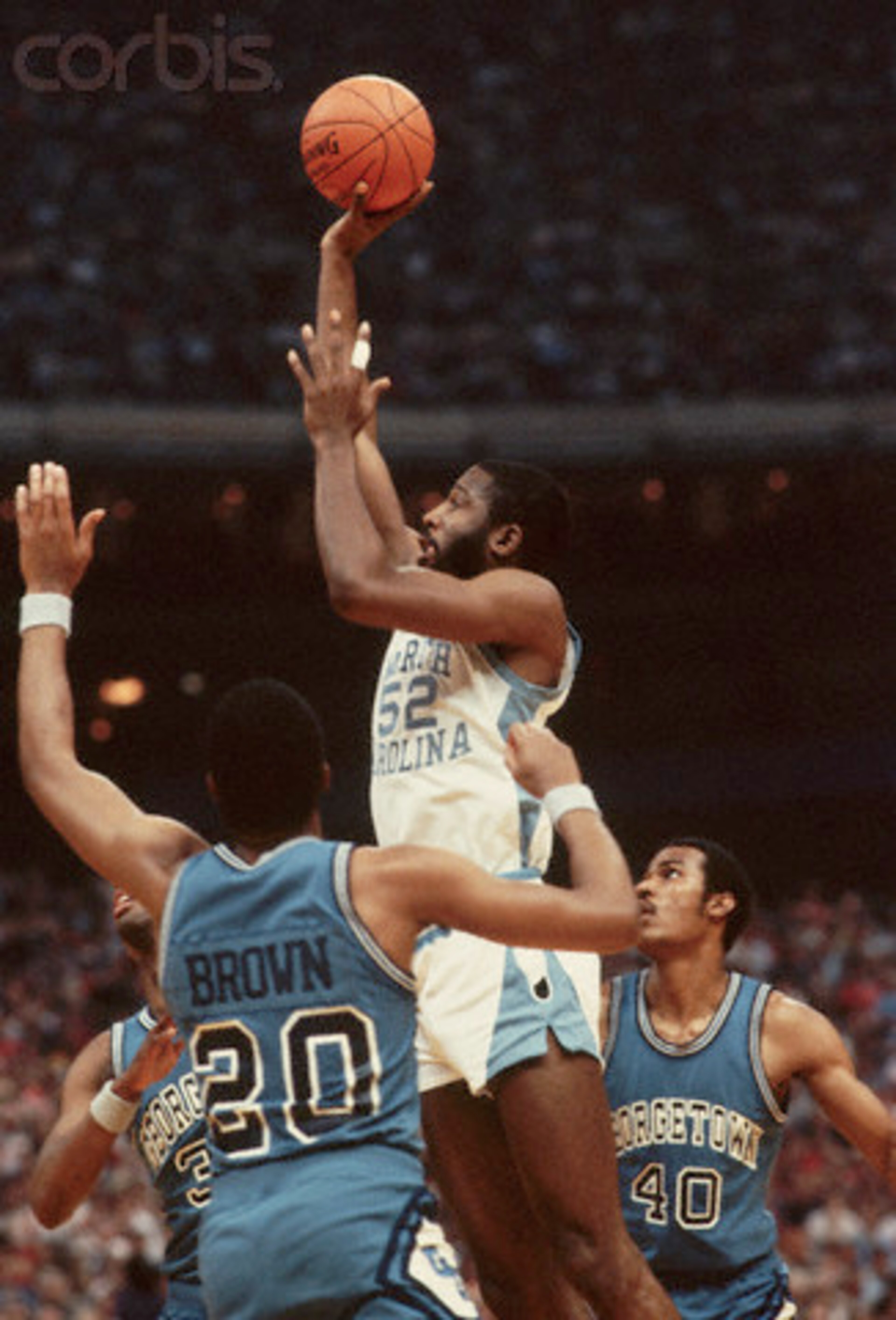 James Worthy reminds Georgetown's Fred Brown who he plays for.
