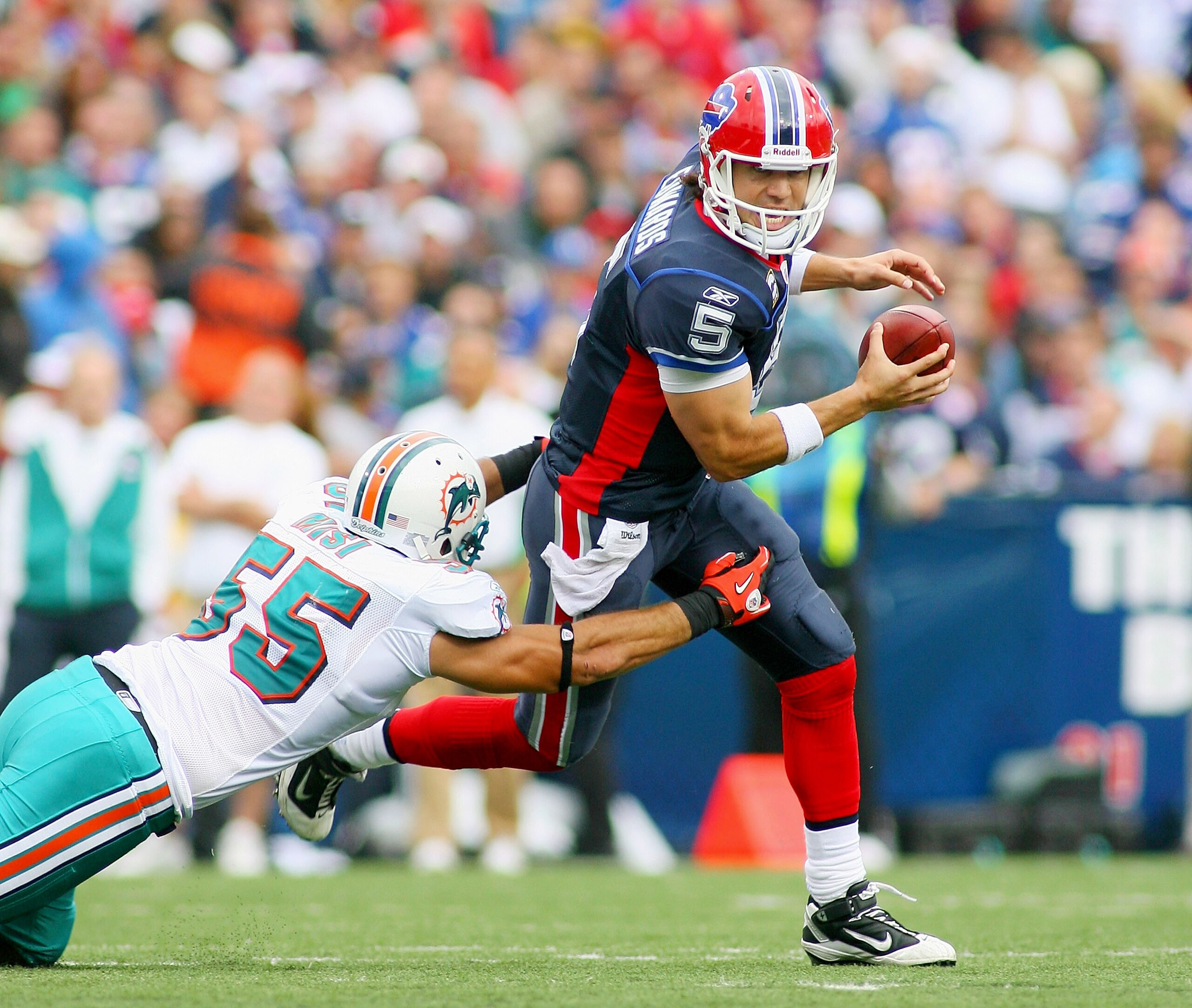 ORCHARD PARK, NY - SEPTEMBER 12:  Trent Edwards #5 the Buffalo Bills is sacked by Koa Misi #55 of the Miami Dolphins during the NFL season opener at Ralph Wilson Stadium on September 12, 2010 in Orchard Park, New York. Miami won 15-10. (Photo by Rick Stew