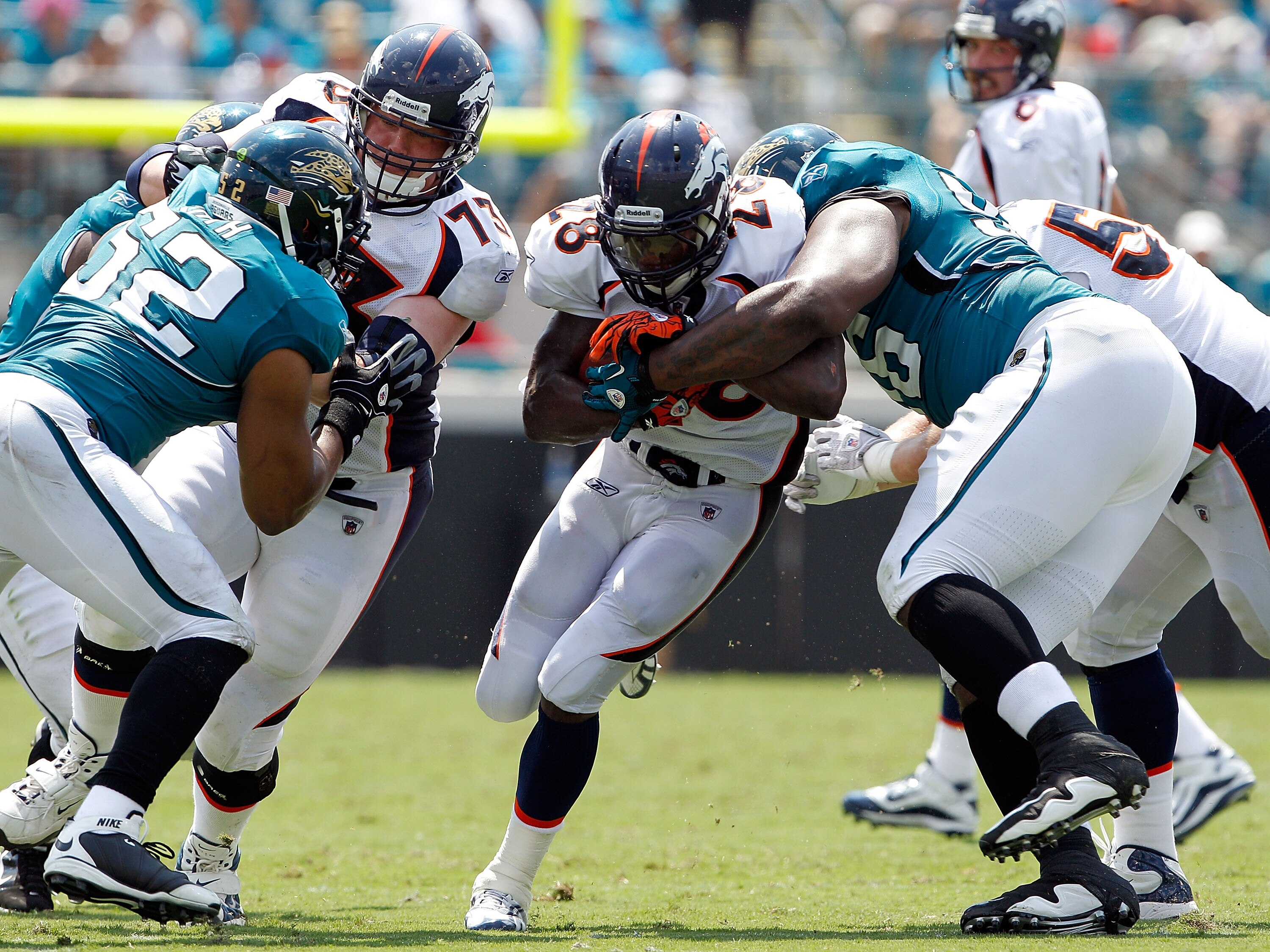 JACKSONVILLE, FL - SEPTEMBER 12:  Terrance Knighton #96 of the Jacksonville Jaguars attempts to tackle Correll Buckhalter #28 of the Denver Broncos during the NFL season opener game at EverBank Field on September 12, 2010 in Jacksonville, Florida.  (Photo
