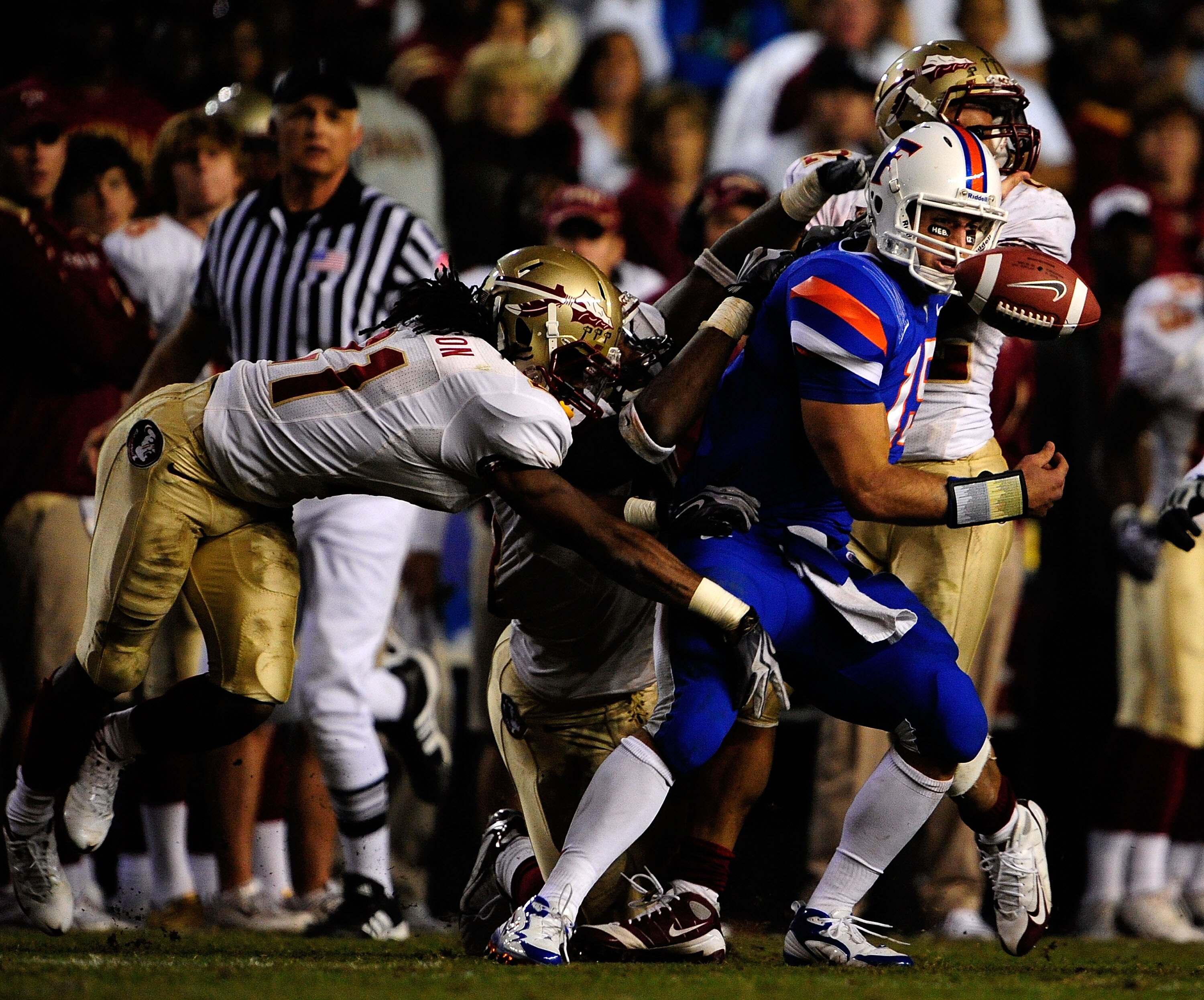 GAINESVILLE, FL - NOVEMBER 28:  Tim Tebow #15 of the Florida Gators fumbles after a strip by Patrick Robinson #21 of the Florida State Seminoles at Ben Hill Griffin Stadium on November 28, 2009 in Gainesville, Florida.  (Photo by Sam Greenwood/Getty Image