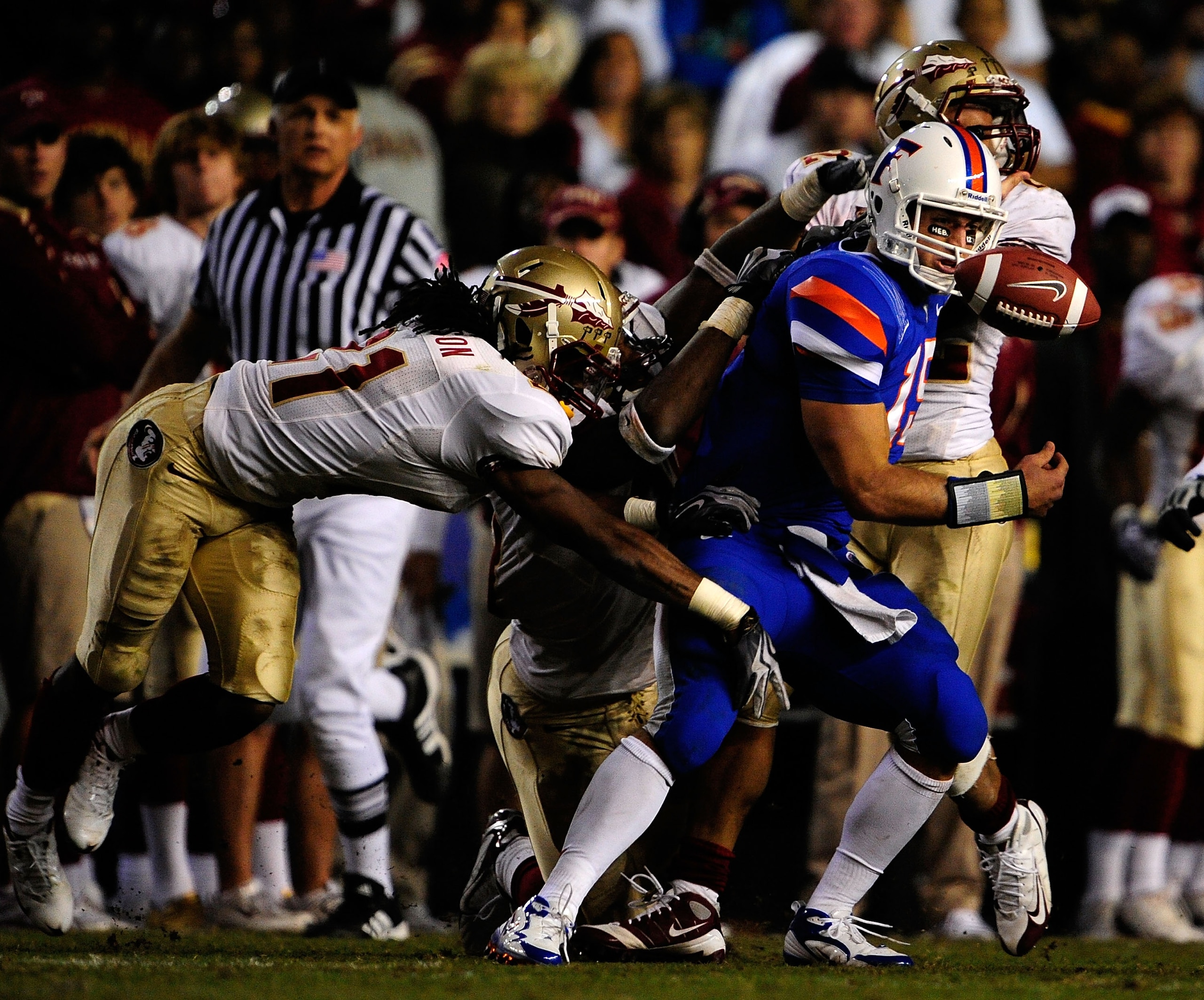 GAINESVILLE, FL - NOVEMBER 28:  Tim Tebow #15 of the Florida Gators fumbles after a strip by Patrick Robinson #21 of the Florida State Seminoles at Ben Hill Griffin Stadium on November 28, 2009 in Gainesville, Florida.  (Photo by Sam Greenwood/Getty Image