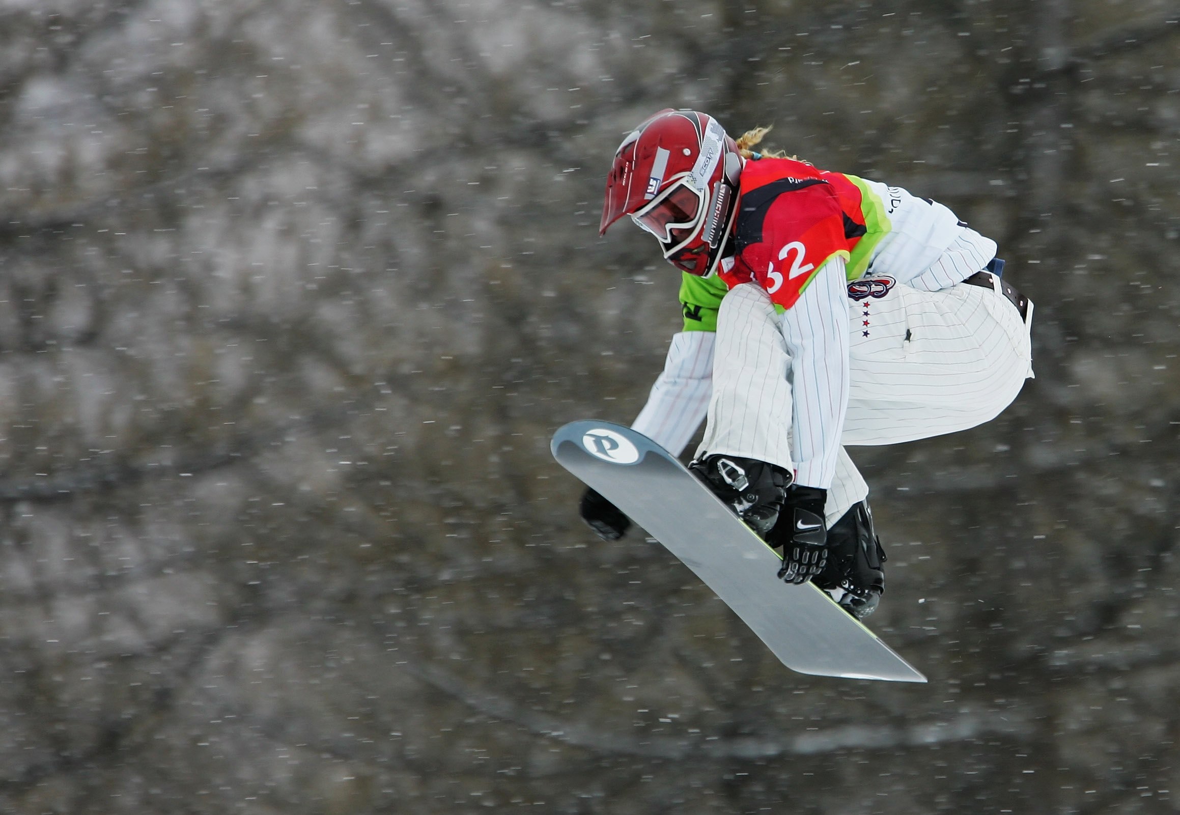 BARDONECCHIA, ITALY - FEBRUARY 17:  Lindsey Jacobellis of the United States competes in the Womens Snowboard Cross Qualifying on Day 7 of the 2006 Turin Winter Olympic Games on February 17, 2006 in Bardonecchia, Italy.  (Photo by Clive Mason/Getty Images)