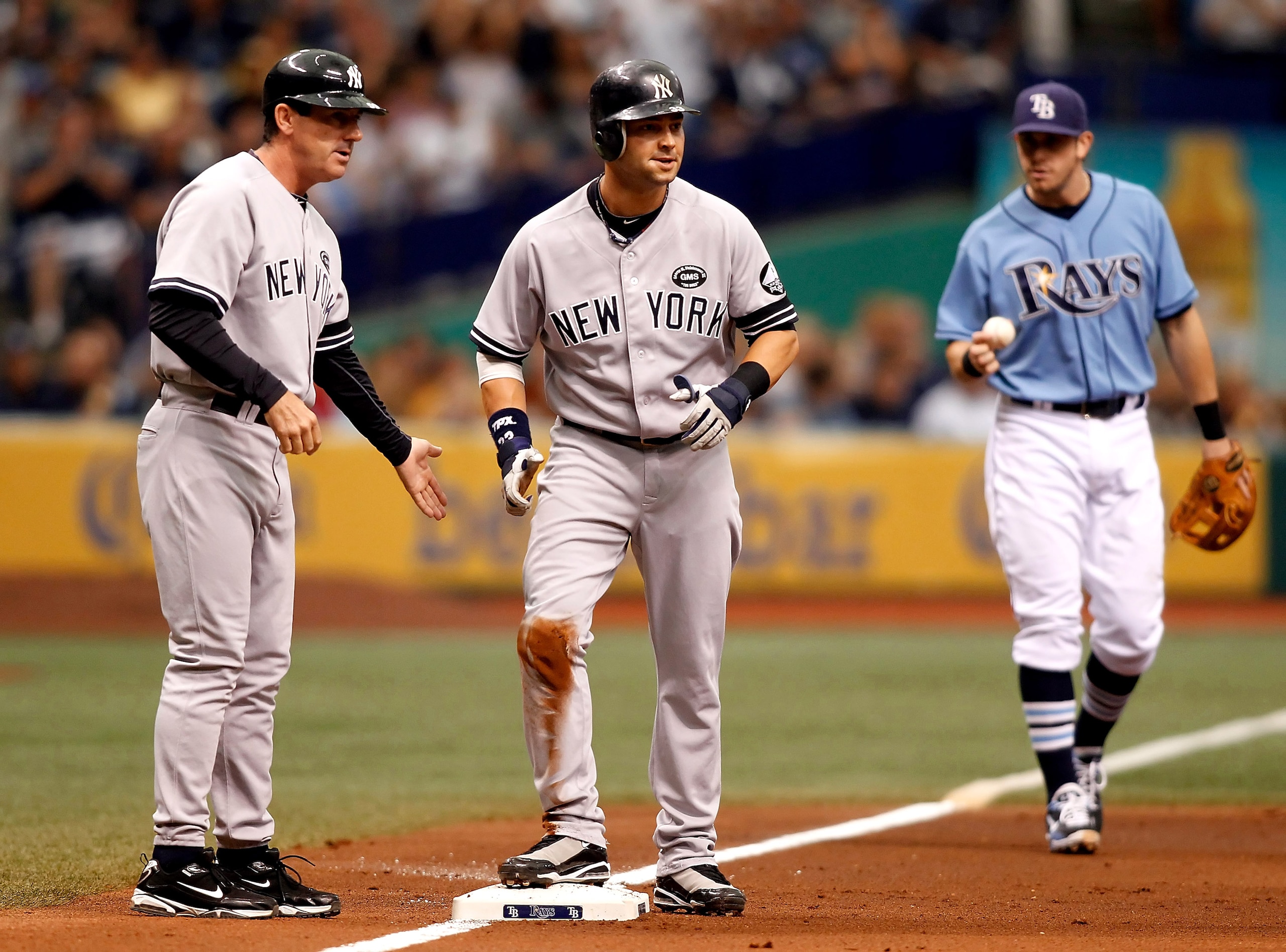 ST PETERSBURG, FL - AUGUST 01:  Outfielder Nick Swisher #33 of the New York Yankees advances to third against the Tampa Bay Rays during the game at Tropicana Field on August 1, 2010 in St. Petersburg, Florida.  (Photo by J. Meric/Getty Images)