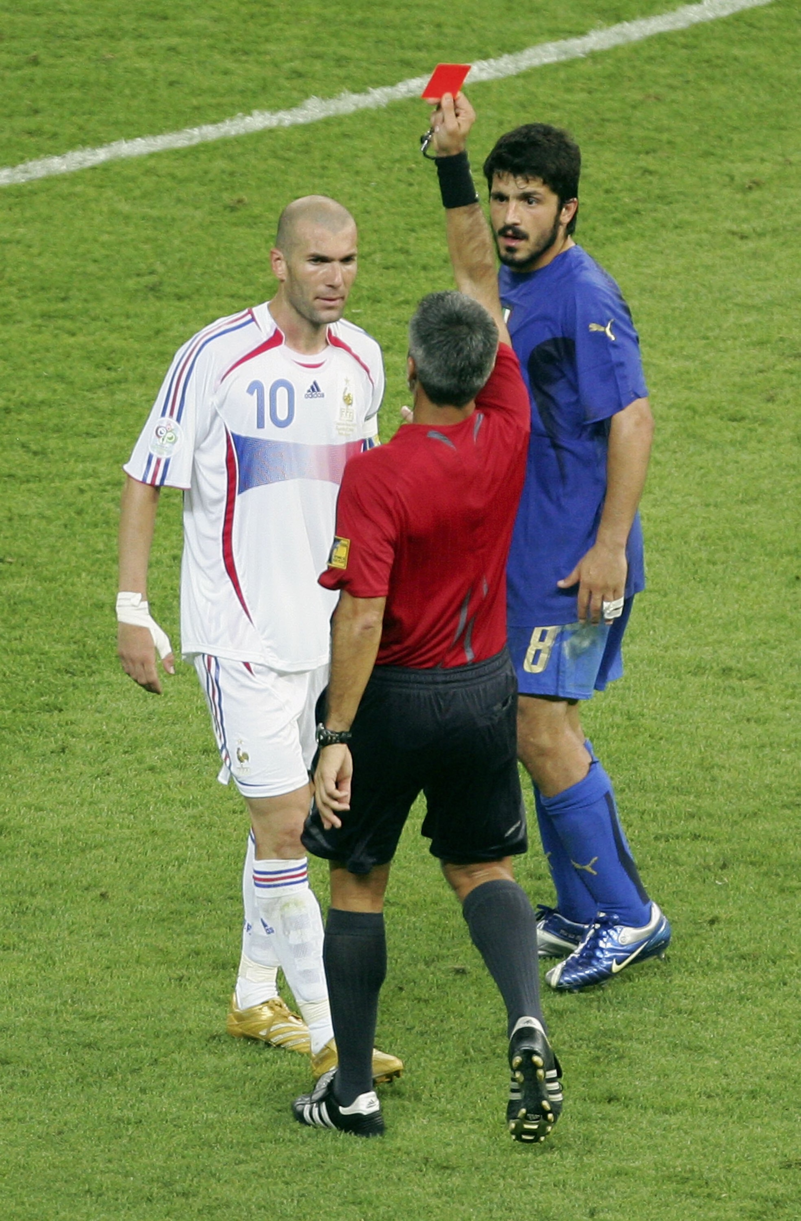 BERLIN - JULY 09:  Zinedine Zidane (L) of France is shown the red card by Referee Horacio Elizondo of Argentina as Gennaro Gattuso of Italy looks on during the FIFA World Cup Germany 2006 Final match between Italy and France at the Olympic Stadium on July