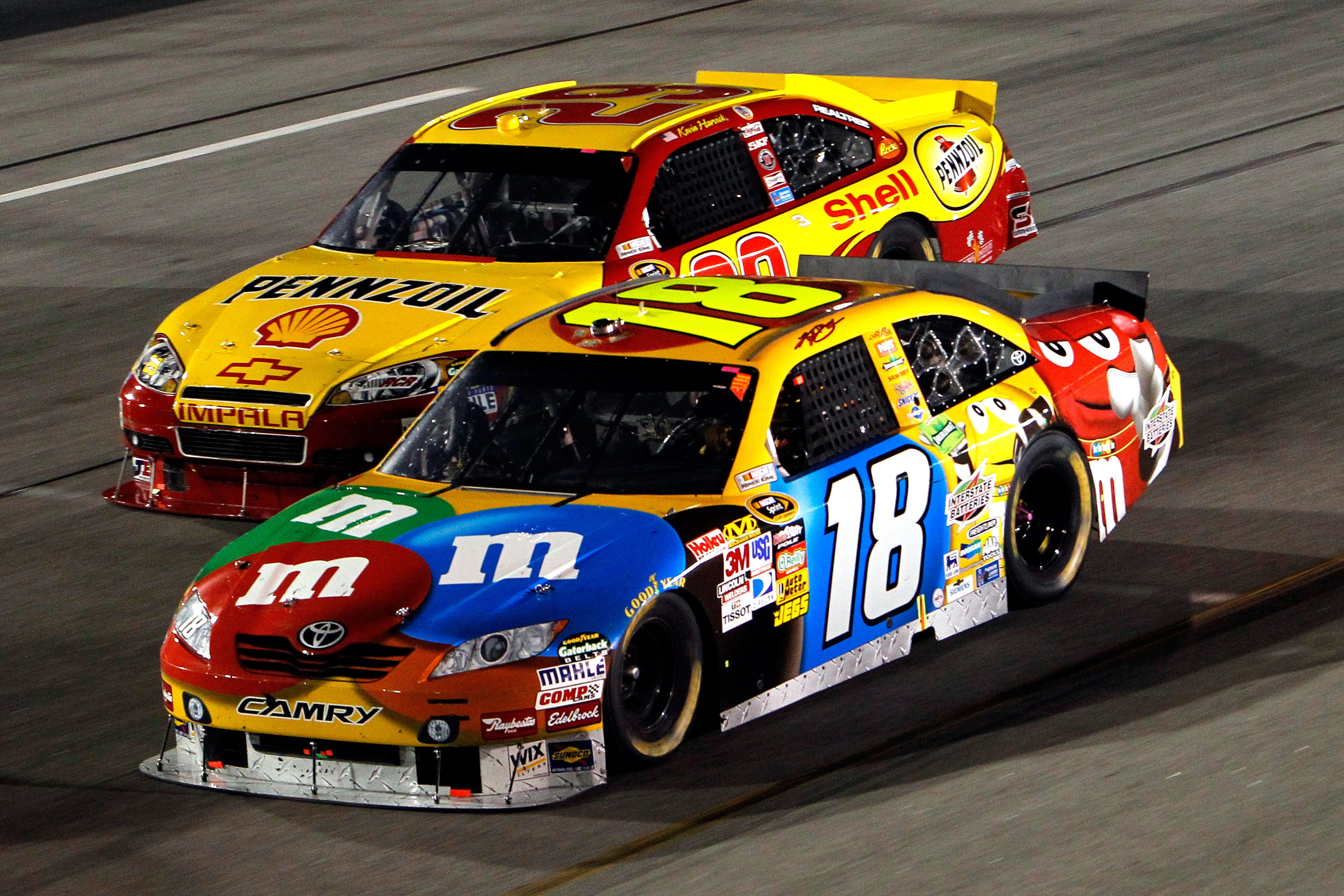 RICHMOND, VA - SEPTEMBER 11:  Kyle Busch, driver of the #18 M&M's Toyota, races Kevin Harvick, driver of the #29 Shell/Pennzoil Chevrolet, during the NASCAR Sprint Cup Series Air Guard 400 at Richmond International Raceway on September 11, 2010 in Richmon