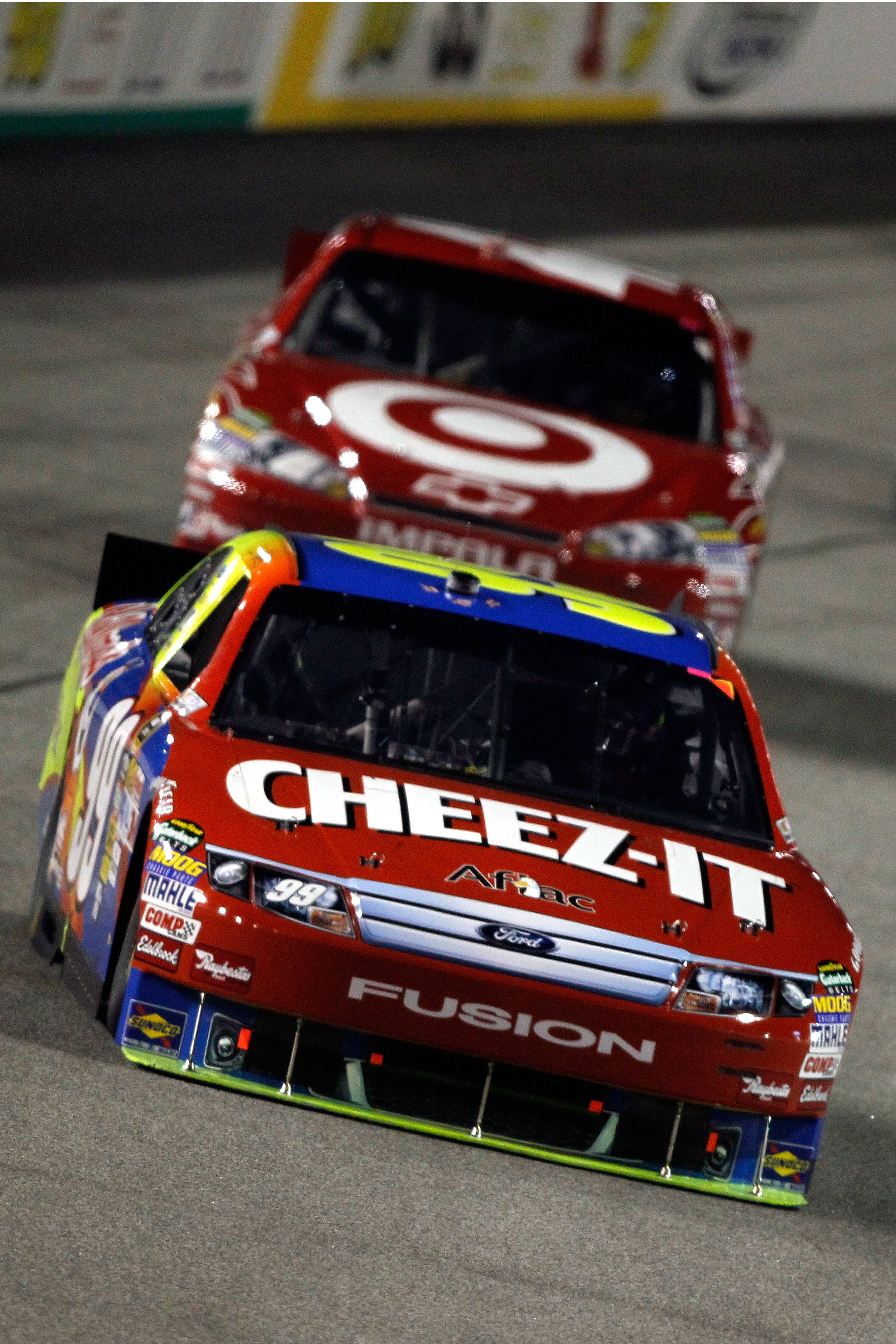 RICHMOND, VA - SEPTEMBER 11:  Carl Edwards, driver of the #99 Kellogg's/Cheez-It Ford, leads Juan Pablo Montoya, driver of the #42 Target Chevrolet, during the NASCAR Sprint Cup Series Air Guard 400 at Richmond International Raceway on September 11, 2010