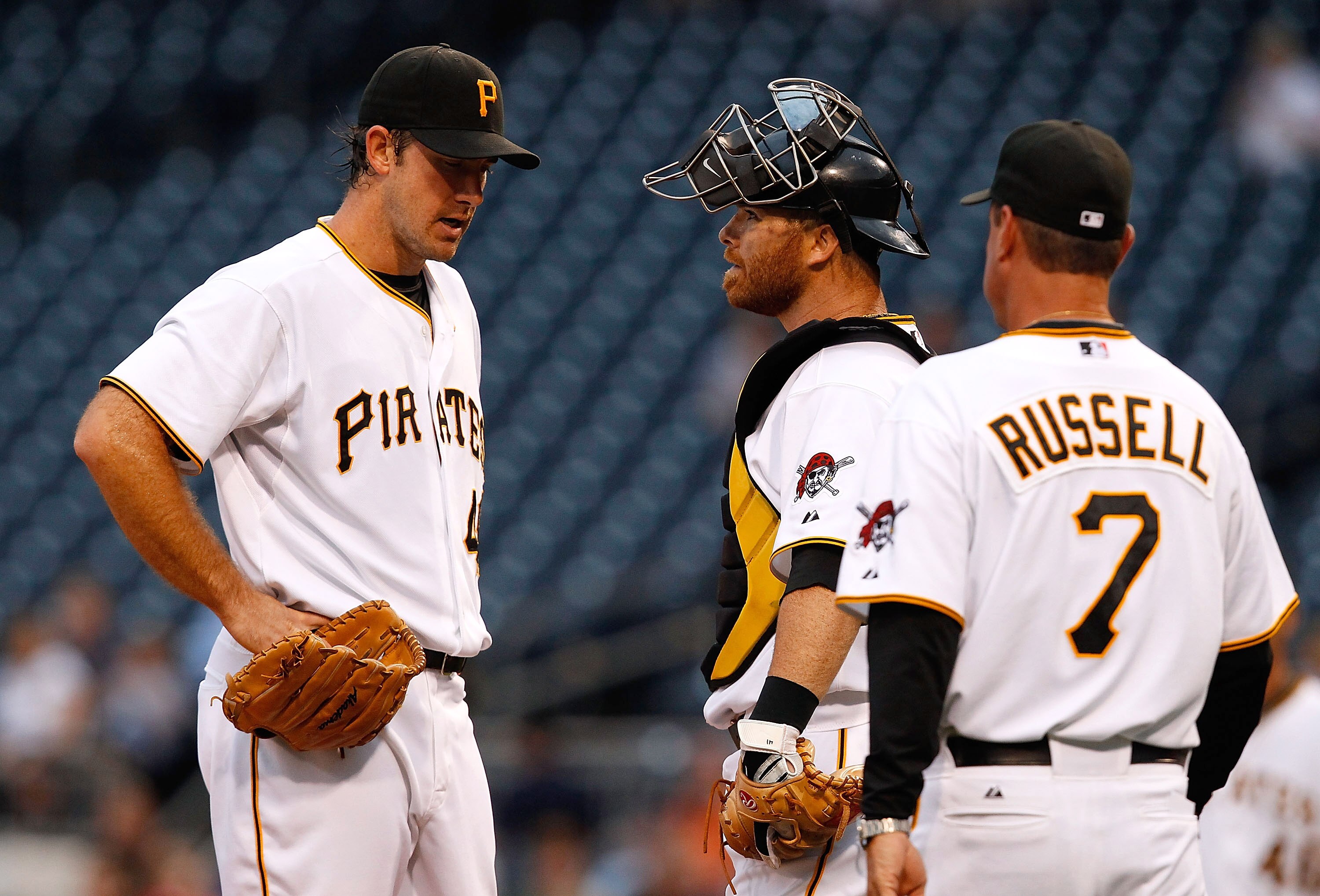 PITTSBURGH - AUGUST 23:  Ross Ohlendorf #49 of the Pittsburgh Pirates talks with Ryan Doumit #41 and manager John Russell #7 before leaving the game with an unknown injury during the game against the St Louis Cardinals on August 23, 2010 at PNC Park in Pi