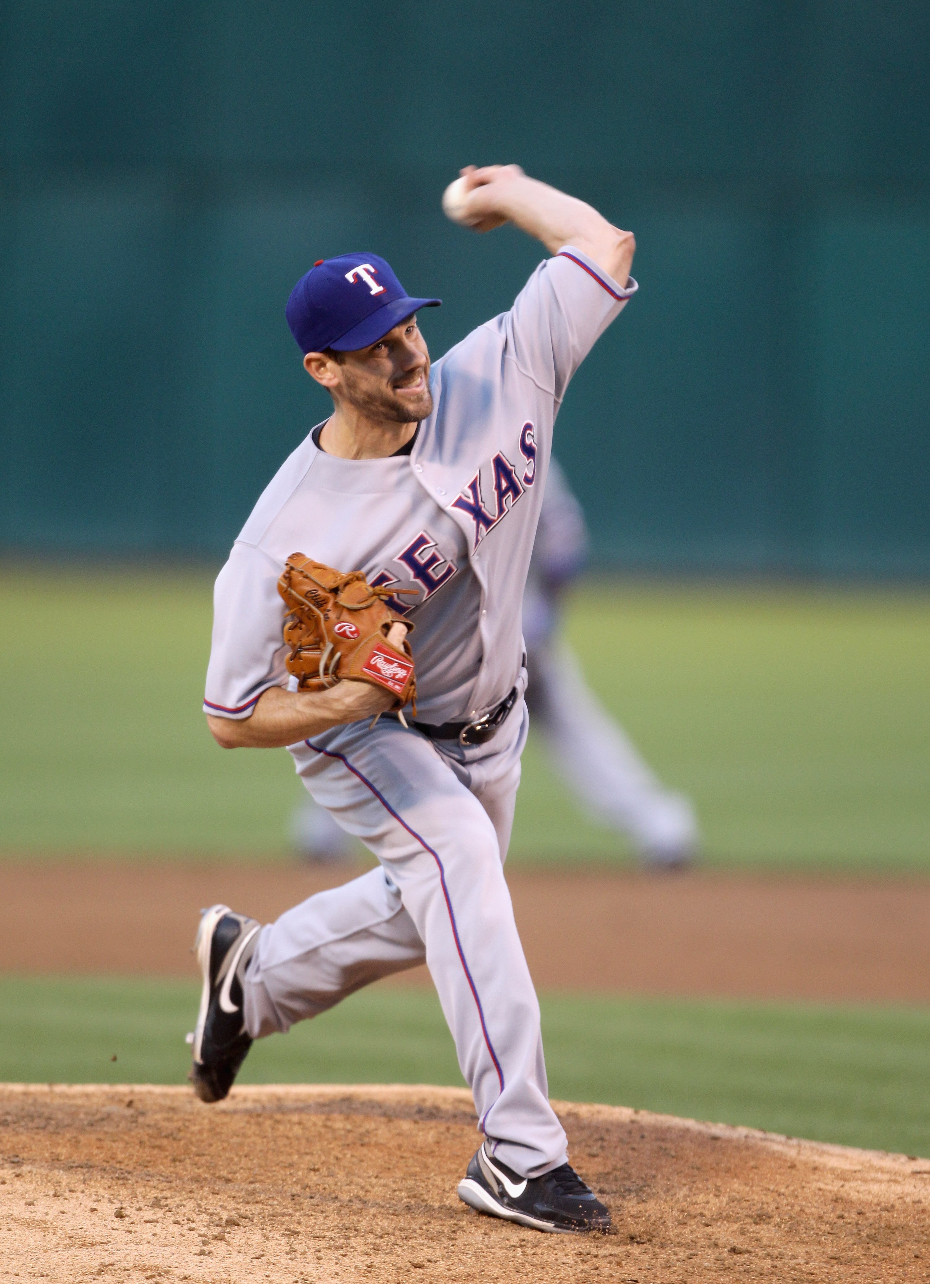 OAKLAND, CA - AUGUST 06:  Cliff Lee #33 of the Texas Rangers pitches against the Oakland Athletics at the Oakland-Alameda County Coliseum on August 6, 2010 in Oakland, California.  (Photo by Ezra Shaw/Getty Images)