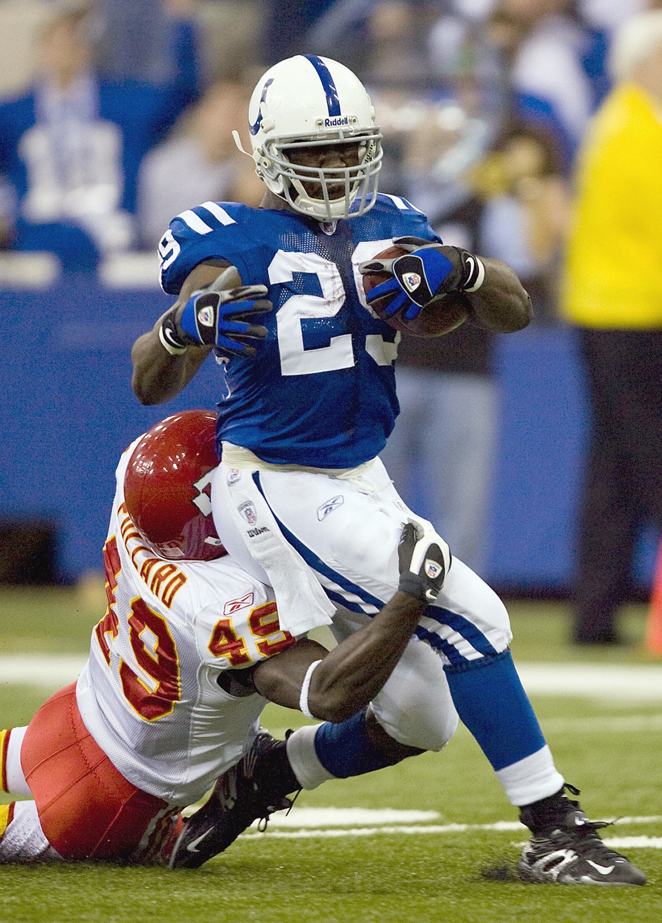 INDIANAPOLIS - NOVEMBER 18: Joseph Addai #29 of the Indianapolis Colts rushes against Bernard Pollard #49 of the Kansas City Chiefs on November 18, 2007 at the RCA Dome in Indianapolis, Indiana. The Colts defeated the Chiefs 13-10. (Photo by Dilip Vishwan