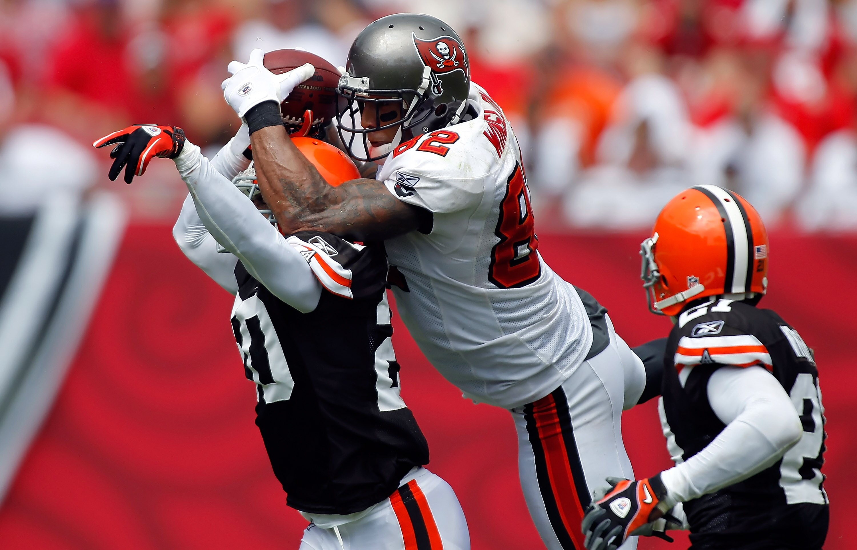 TAMPA, FL - SEPTEMBER 12:  Tight end Kellen Winslow #82 of the Tampa Bay Buccaneers tries to make this catch as defender Mike Adams #20 of the Cleveland Browns breaks up the play during the game at Raymond James Stadium on September 12, 2010 in Tampa, Flo