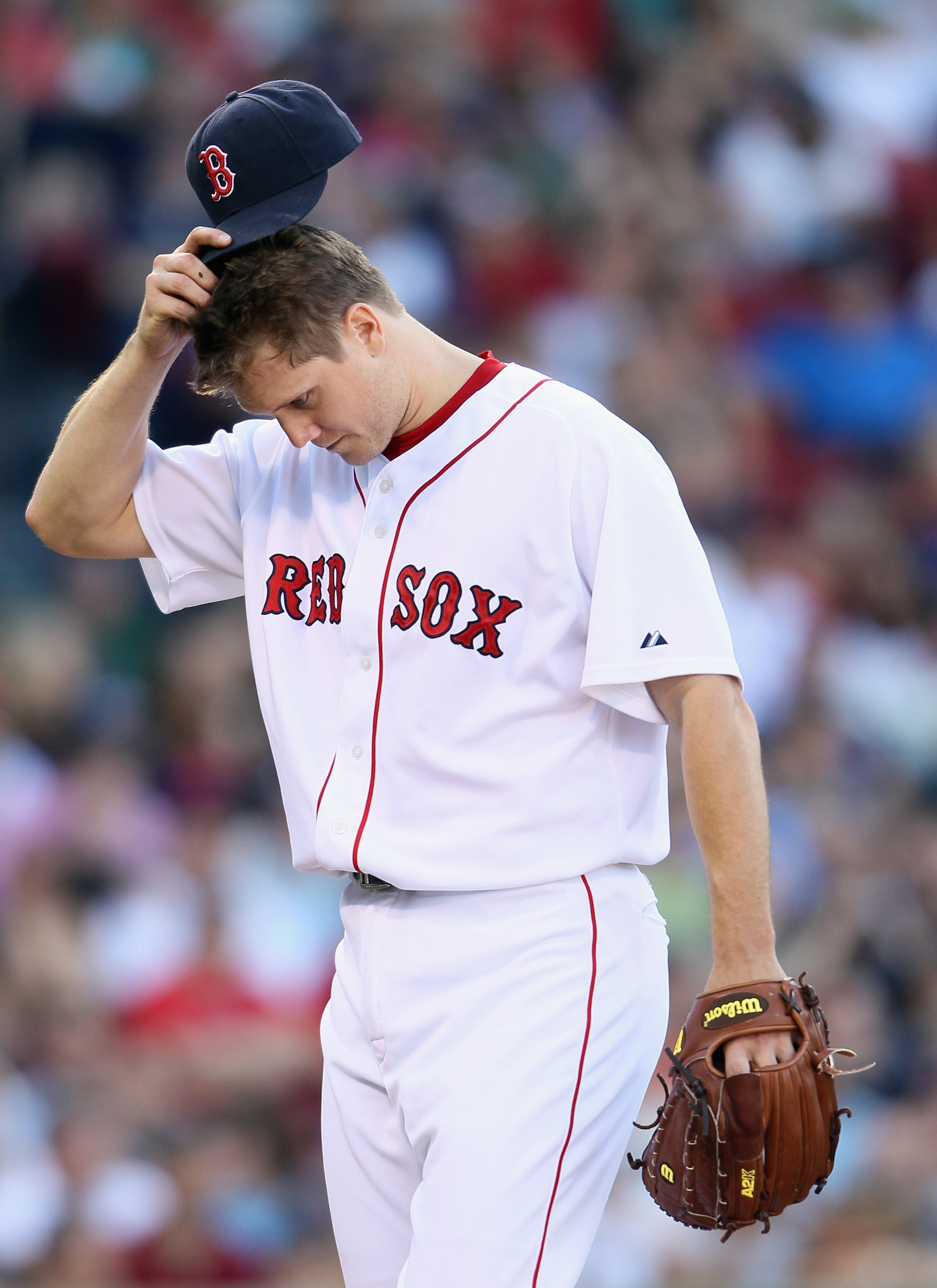 BOSTON - SEPTEMBER 05: Jonathan Papelbon #58 of the Boston Red Sox heads for the dugout after he is pulled in the ninth inning against the Chicago White Sox on September 5, 2010 at Fenway Park in Boston, Massachusetts.  (Photo by Elsa/Getty Images)