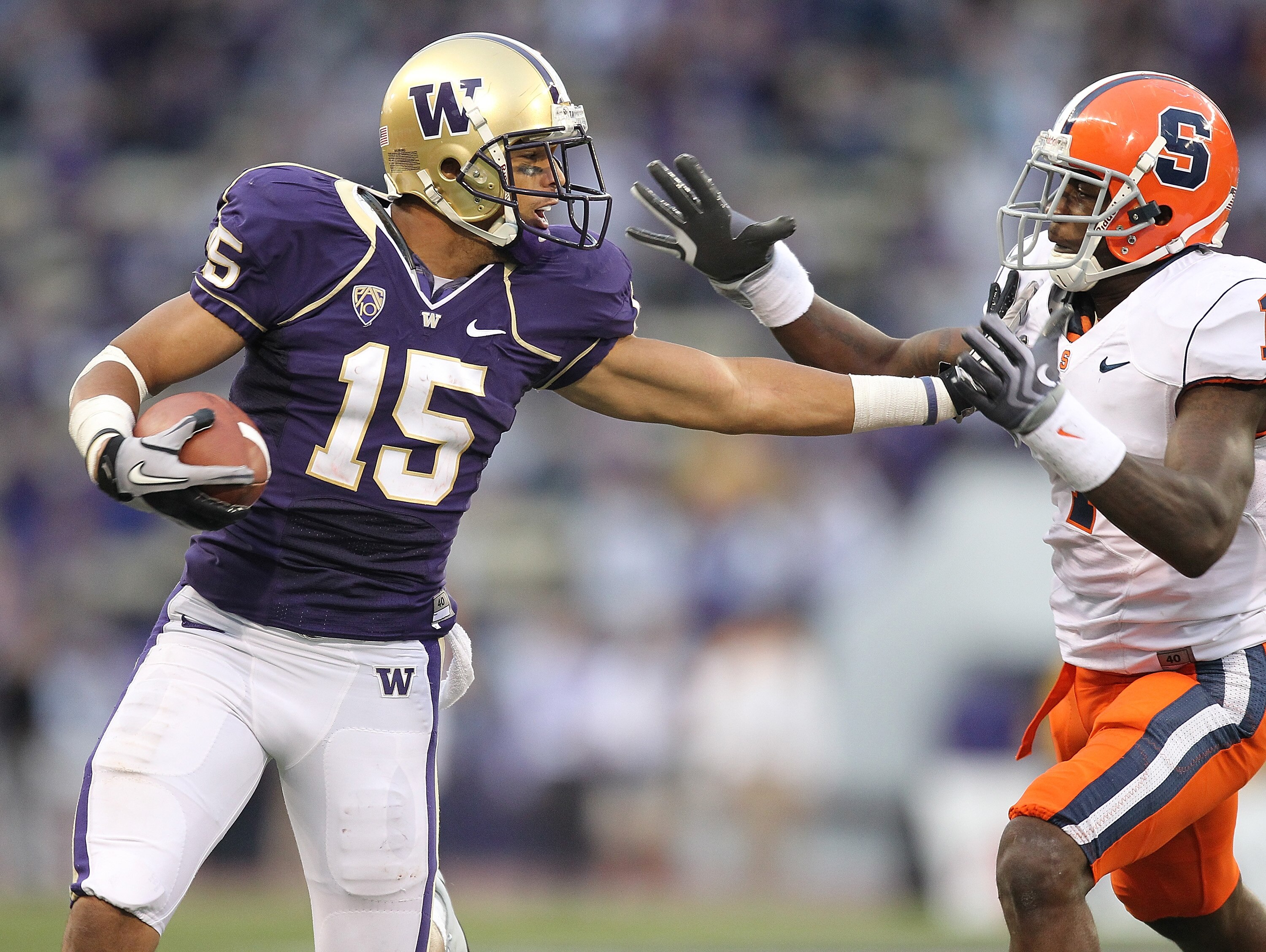SEATTLE - SEPTEMBER 11:  Wide receiver Jermaine Kearse #15 of the Washington Huskies rushes against Phillip Thomas #1 of the Syracuse Orange on September 11, 2010 at Husky Stadium in Seattle, Washington. The Huskies defeated the Orange 41-20. (Photo by Ot