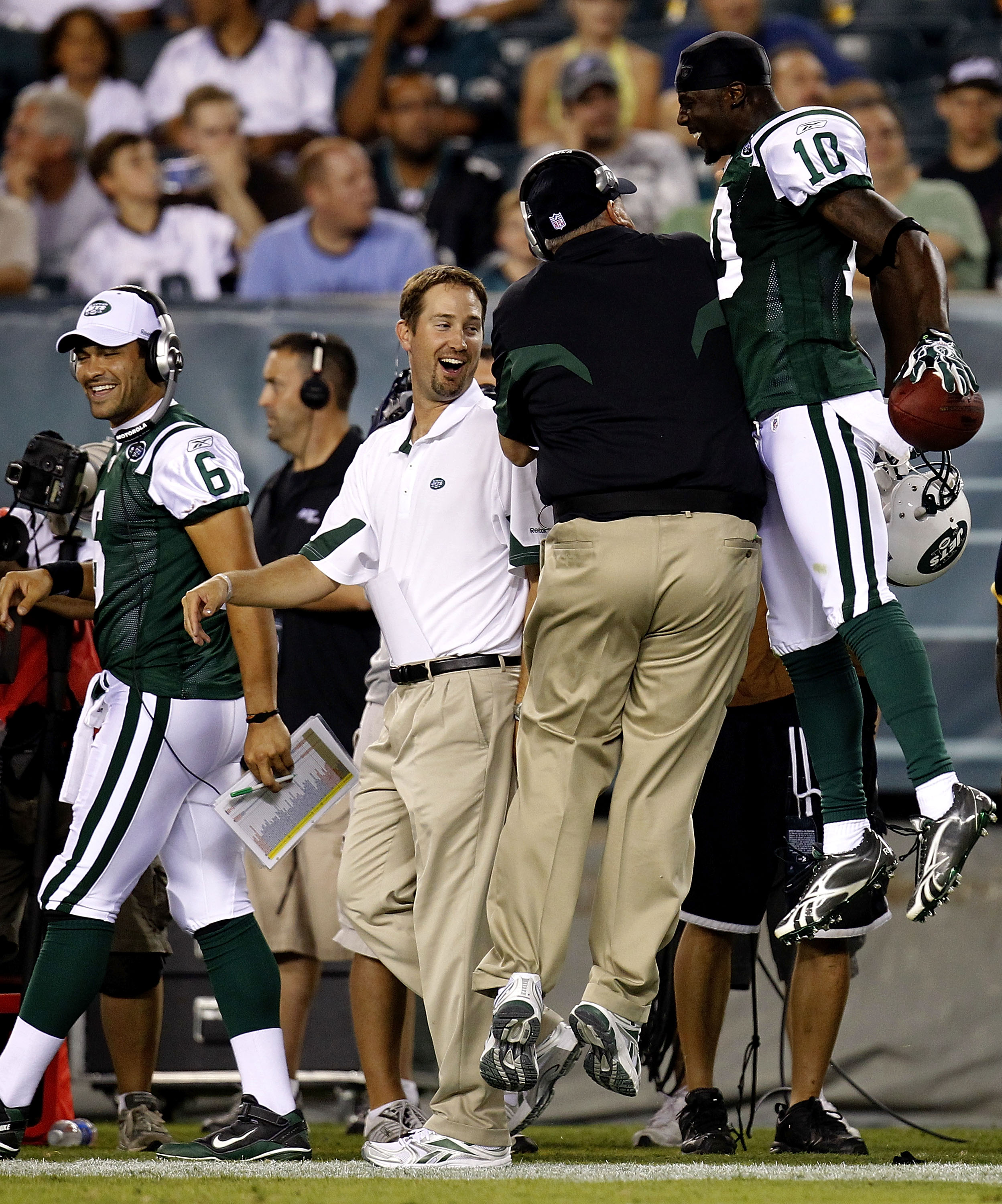 PHILADELPHIA - SEPTEMBER 02: Santonio Holmes #10 and head coach Rex Ryan (back to camera) of the New York Jets celebrate a touchdown as Mark Sanchez #6 and offensive coordinator Brian Schottenheimer of the Jets look on in a preseason game against the Phil