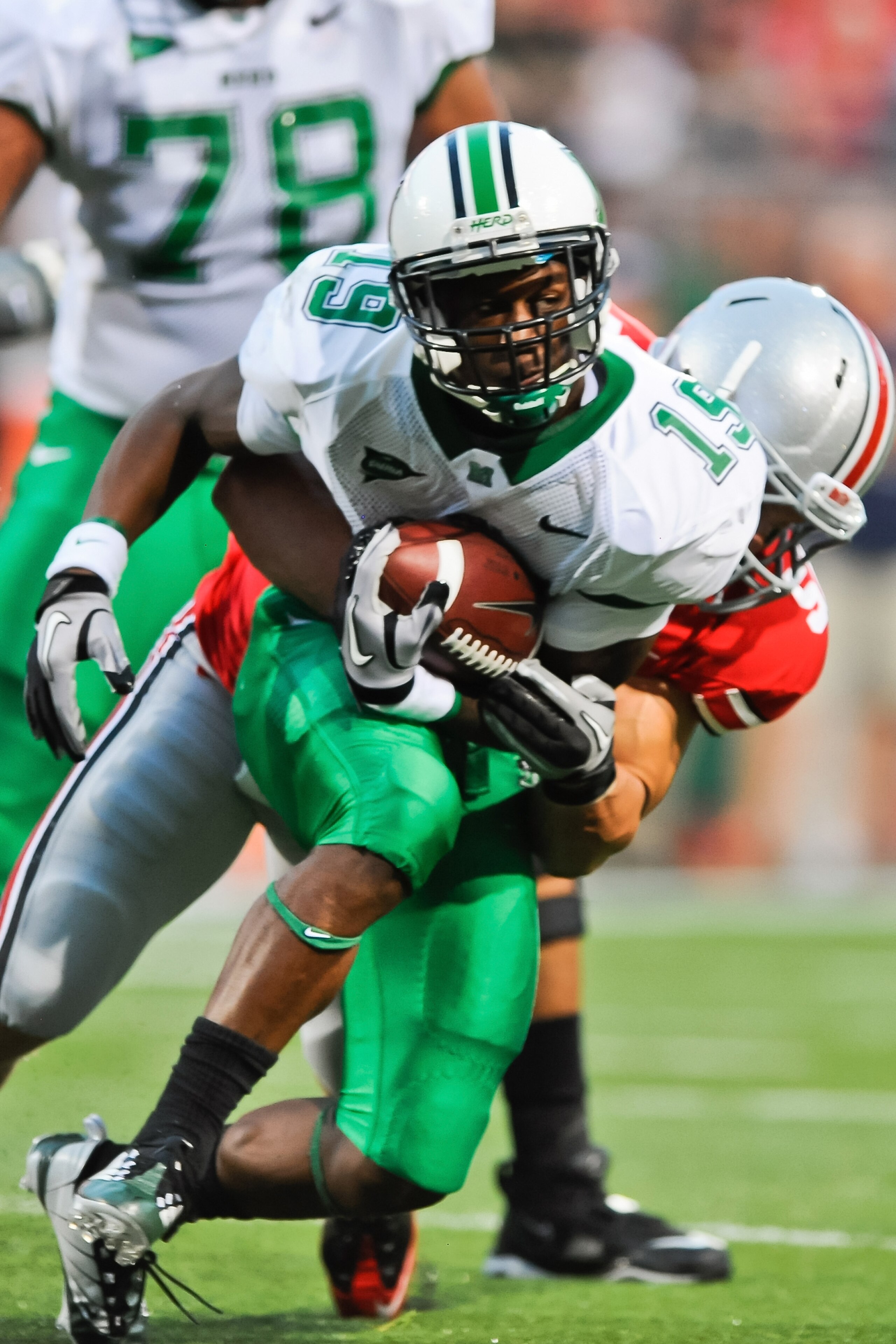 COLUMBUS, OH - SEPTEMBER 2: Andre Booker #19 of the Marshall Thundering Herd runs with the ball against the Ohio State Buckeyes at Ohio Stadium on September 2, 2010 in Columbus, Ohio. (Photo by Jamie Sabau/Getty Images)