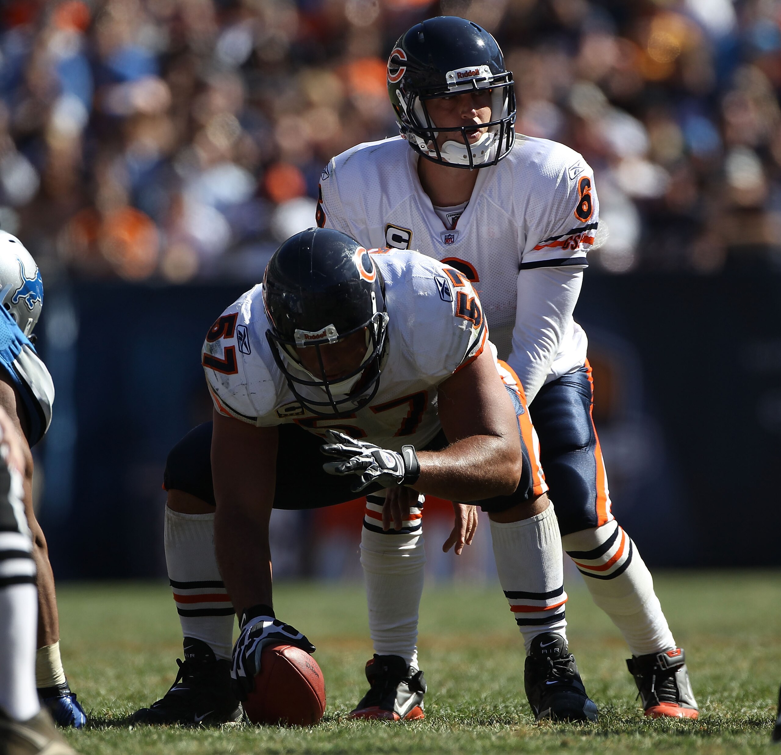 CHICAGO - SEPTEMBER 12: Jay Cutler #6 of the Chicago Bears calls play signals as teammate Olin Kreutz #57 prepares to snap the ball against the Detroit Lions during the NFL season opening game at Soldier Field on September 12, 2010 in Chicago, Illinois. T