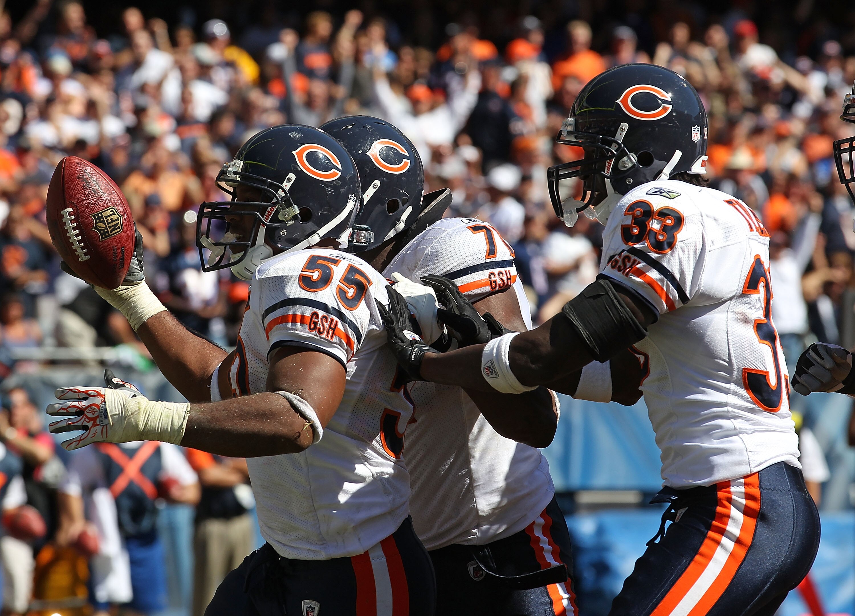 CHICAGO - SEPTEMBER 12: Lance Briggs #55 of the Chicago Bears celebrates a turn-over with teammates Israel Idonije #71 and Charles Tillman #33 during the NFL season opening game against the Detroit Lions at Soldier Field on September 12, 2010 in Chicago, 