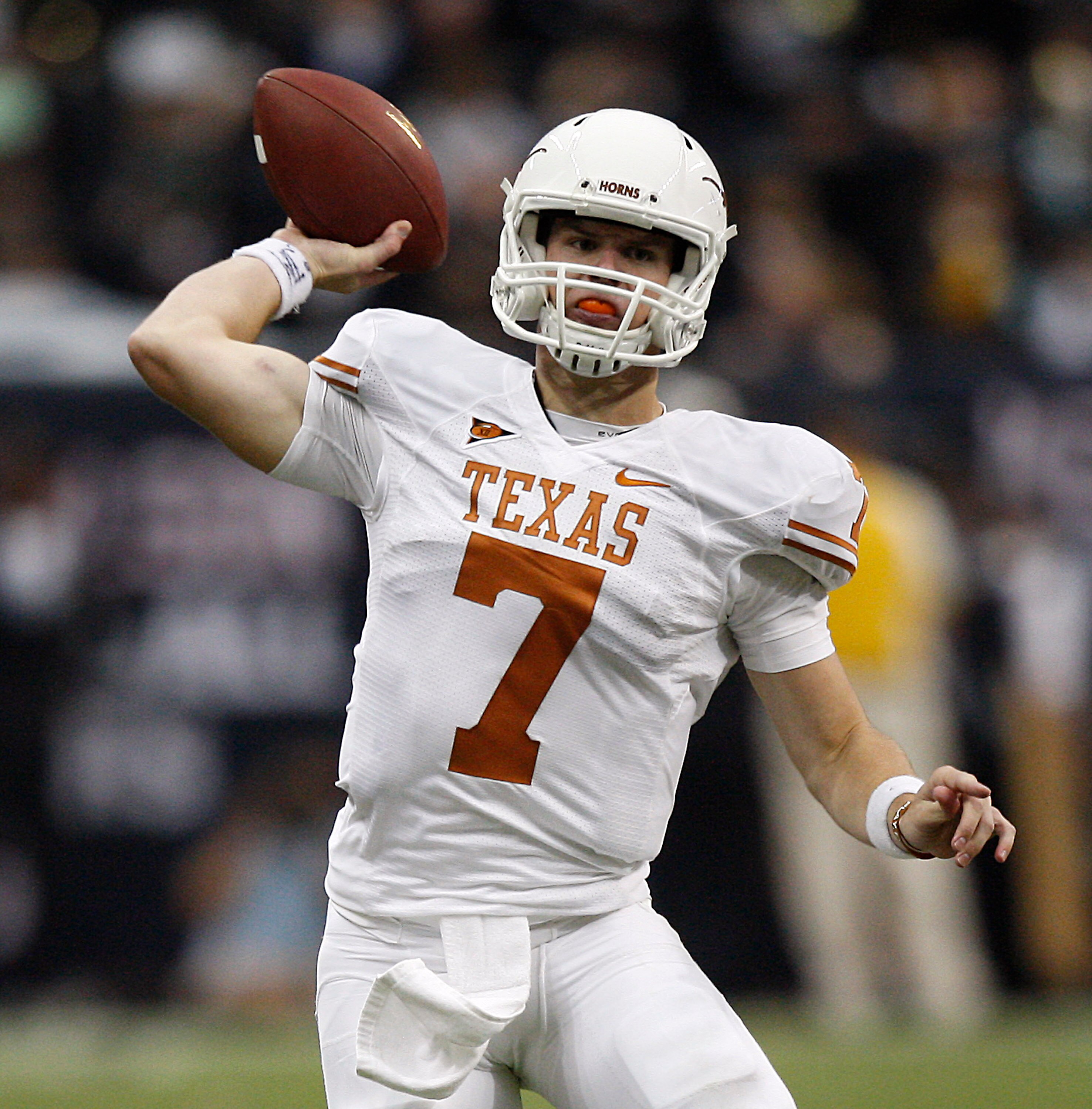 HOUSTON - SEPTEMBER 04:  Quarterback Garrett Gilbert #7 of the Texas Longhorns during game action against the Rice Owls at Reliant Stadium on September 4, 2010 in Houston, Texas. Texas won 34-17.  (Photo by Bob Levey/Getty Images)