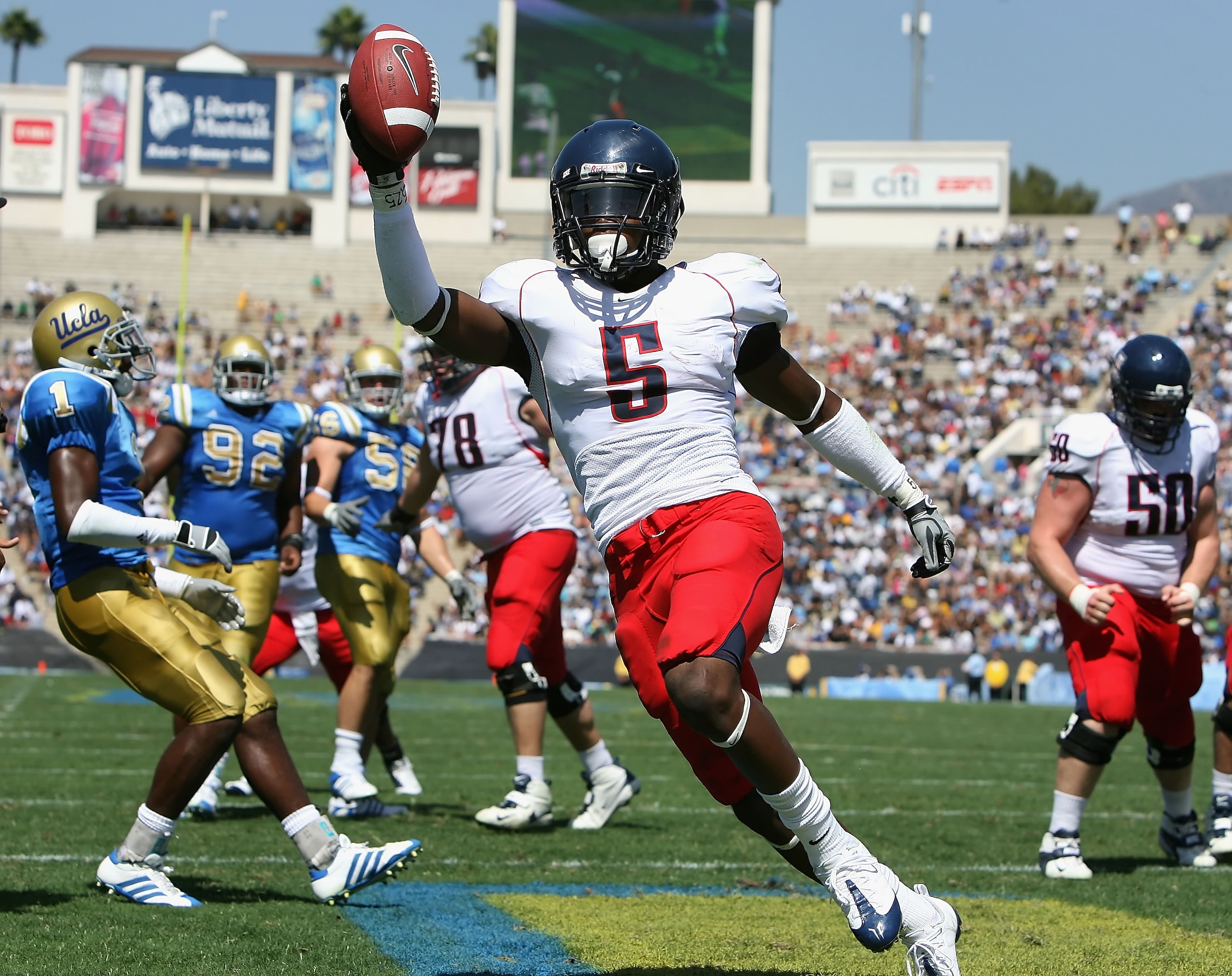 PASADENA, CA - SEPTEMBER 20:  Running back Nic Grigsby #5 of the Arizona Wildcats celebrates after scoring a 3 yard rushing touchdown against the UCLA Bruins during the second quarter of the college football game at the Rose Bowl on September 20, 2008 in