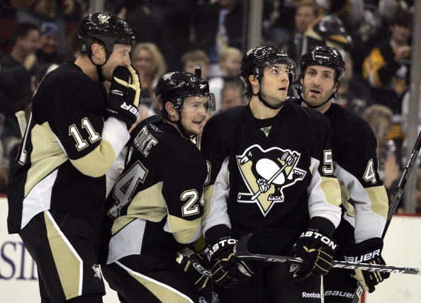 PITTSBURGH, PA - JANUARY 7:  Matt Cooke #24 of the Pittsburgh Penguins celebrates his goal with teammates against the Philadelphia Flyers in the first period at Mellon Arena on January 7, 2010 in Pittsburgh, Pennsylvania.  (Photo by Justin K. Aller/Getty