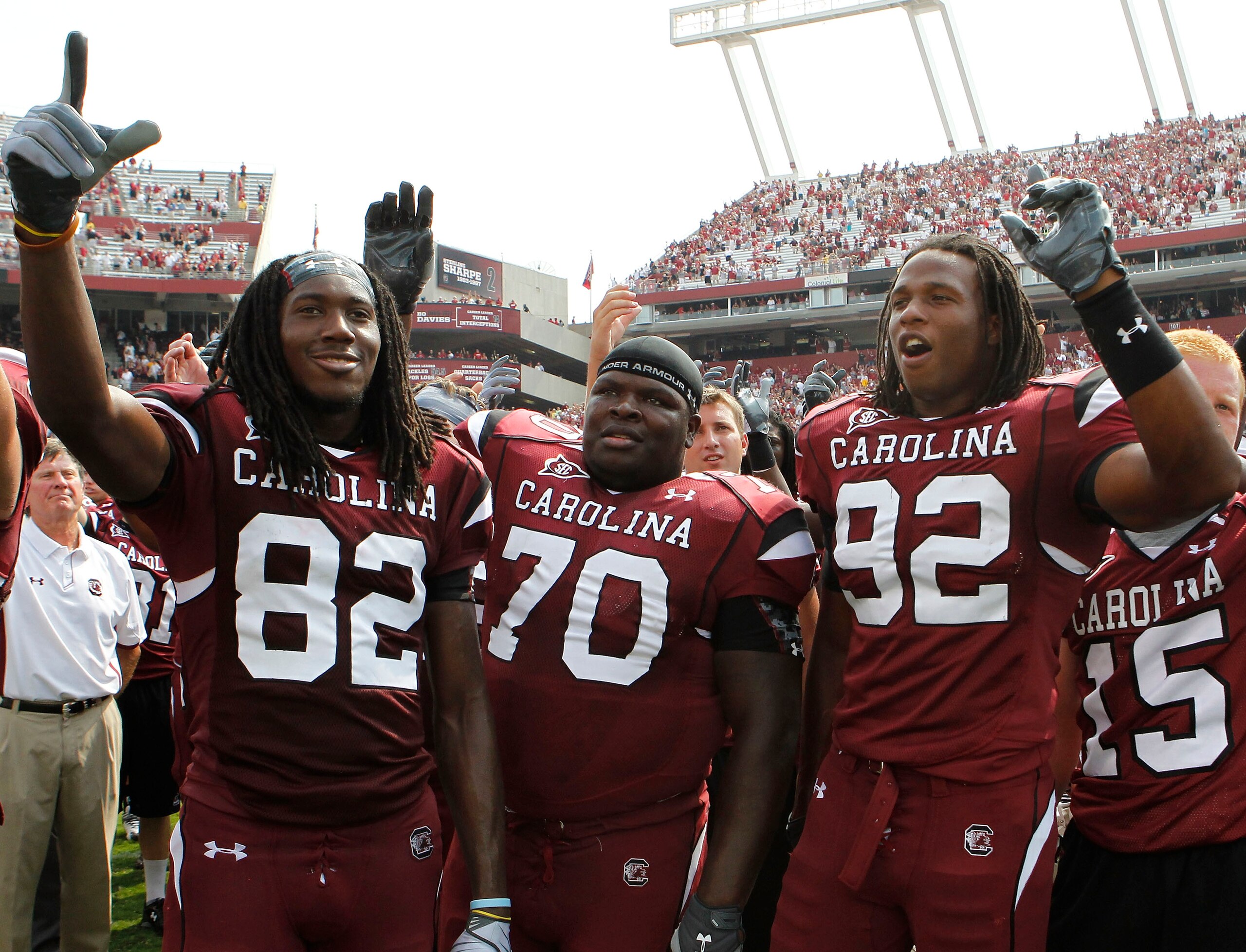 COLUMBIA, SC - SEPTEMBER 11: Tackle Byron Jerideau #70 (center), wide receiver D.L. Moore #82 (left) and defensive end Byron McKnight #92 (right) of the South Carolina Gamecocks during the game against the Georgia Bulldogs at Williams-Brice Stadium on Sep